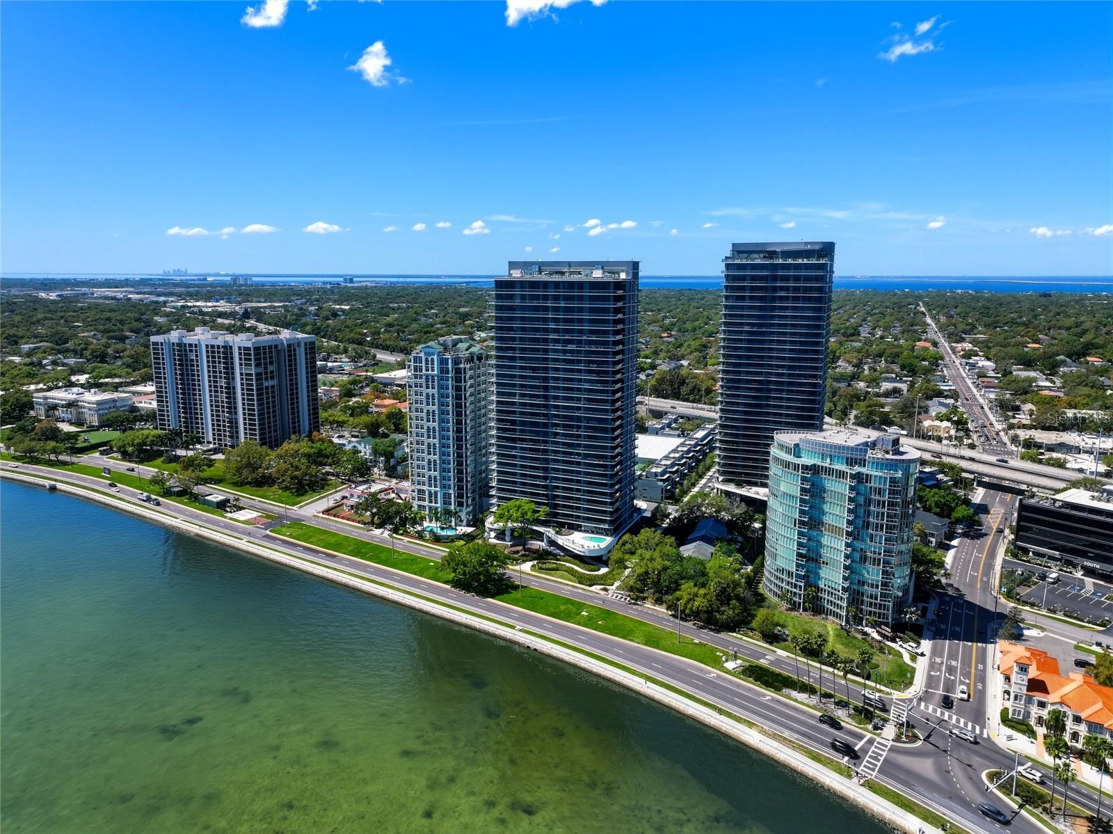 Welcome to unparalleled luxury living in TOWER ONE at the Ritz-Carlton Residences. Located on Tampa’s iconic Bayshore Boulevard. This stunning 3-bedroom, 3.5-bathroom + bonus den residence offering approximately 2,937 square feet of absolute sophistication, seamlessly blending modern design with timeless elegance. Enjoy sunrise and sunset views from your wraparound balconies facing the Bayshore AND an extensive balcony spanning across the back of the unit enjoying western facing sunsets too! All 3 bedrooms have balconies to enjoy year- round views.
Step off the elevator into your private grand entryway, setting the tone for the opulence that awaits. The heart of the home is a chef’s dream kitchen, thoughtfully designed with induction cooktop, dual islands, walk-in pantry, and premium finishes that cater to both functionality and style. Floor-to-ceiling windows bathe the interiors in natural light while offering breathtaking full Eastern and Western views, including a sweeping panorama of Bayshore Boulevard. Electric powered window coverings add convenience and comfort to this sunlit sanctuary.
This corner unit offers a wraparound balcony inviting you to savor sunrise and sunset moments, while the open layout is perfect for hosting or simply enjoying the serene ambiance. Retreat to the primary suite where an incredible custom walk-in closet awaits, offering a level of luxury and organization that is the envy of all fashionistas.
Every detail of this residence has been meticulously curated to elevate your lifestyle, from the expansive living spaces to the thoughtful finishes. Located in one of Tampa’s most prestigious addresses, this is more than a home—it’s a statement.
The Ritz-Carlton lifestyle includes 24-hour concierge, valet, security, along with exclusive resident amenities such as a resort-style pools, state-of-the-art fitness center, private wellness spa, jacuzzi, continental breakfast, and club-level lounge area. Looking to entertain the little ones, come visit the private play area designed just for kids! Do not forget to spend some time perfecting your swing in the golf simulator suite too! The Ritz Residences are conveniently located just moments from Hyde Park, downtown Tampa, fine dining, and cultural venues. This residence offers a rare blend of privacy, prestige, and panoramic views.
Don’t miss the opportunity to experience this masterpiece firsthand. Schedule your private tour today and step into the next chapter of refined living. IF CLOSING IS COMPLETED BY JUNE 30TH, 2026 SELLER AGREES TO COVER 3 MONTHS OF HOA FEES.