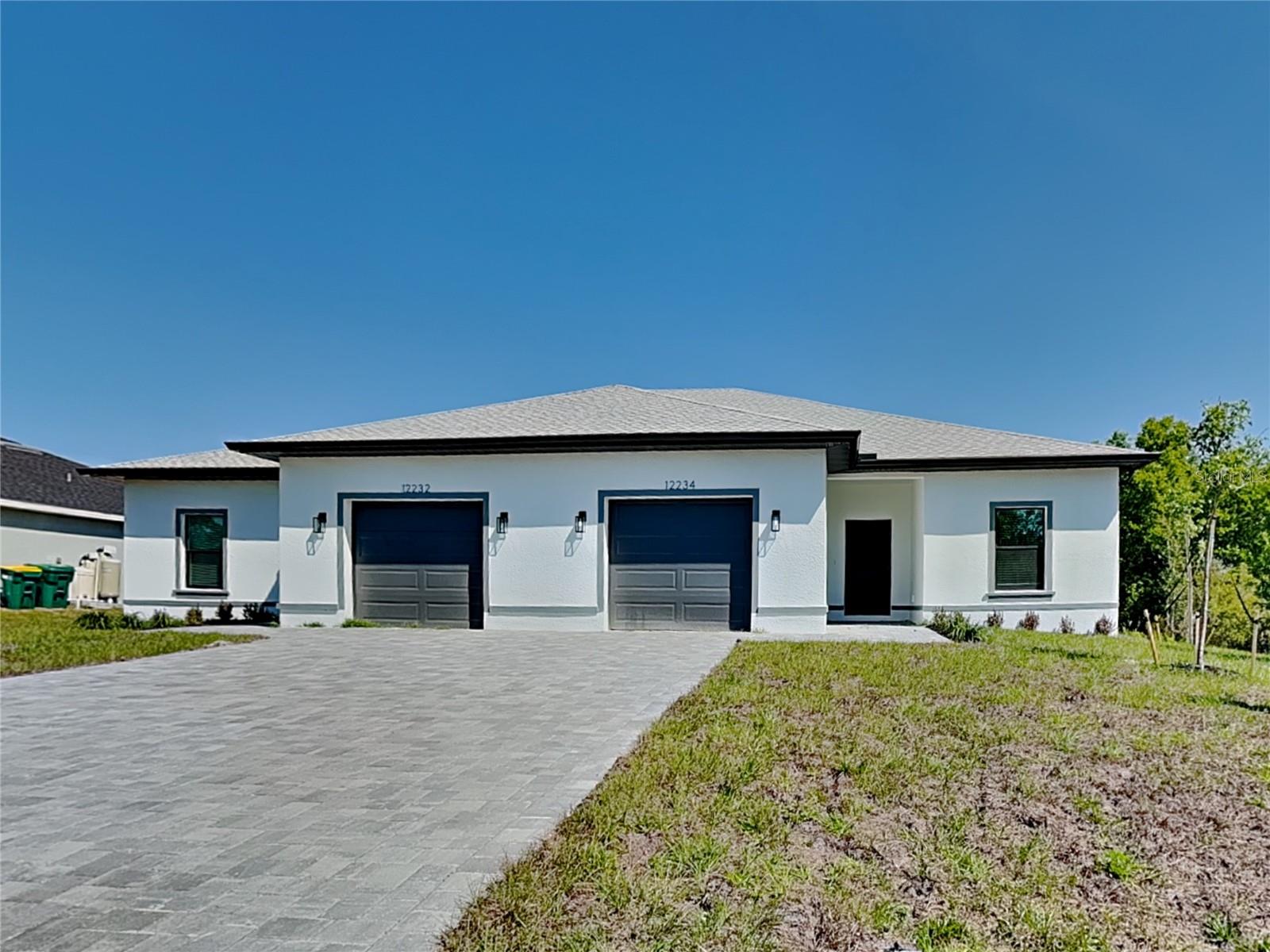 This brand-new duplex by Panther Construction offers a prime opportunity for investors seeking a high-quality, low-maintenance income property. Each unit features 1,182 square feet of well-designed living space along with a private one-car garage.

Built with durability and long-term performance in mind, the property includes hurricane-impact windows and a roof with rain and ice underlayment, helping reduce future maintenance costs and insurance concerns.

Inside, each unit is finished with desirable features that attract and retain tenants, including quartz countertops, stainless steel appliances, MOEN fixtures, and high ceilings that enhance the overall space. The three-panel sliding glass door provide added living area and outdoor appeal.

Exterior upgrades such as a brick paver driveway and strong curb appeal, supporting rental value and tenant interest.