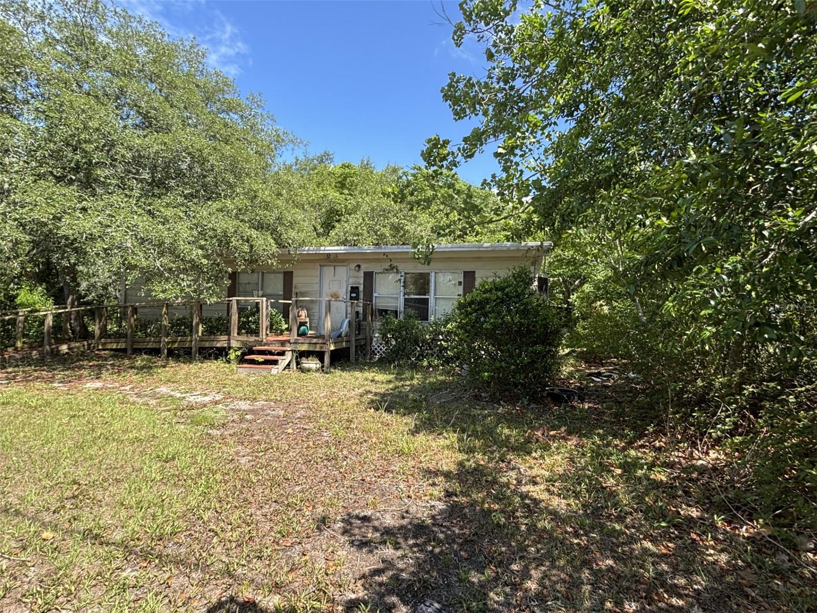 2 Bedroom 2 bath mobile home in Moon Lake Estate on 4 lots. This is a fixer upper. CASH ONLY. Probate is complete and ready for an offer.