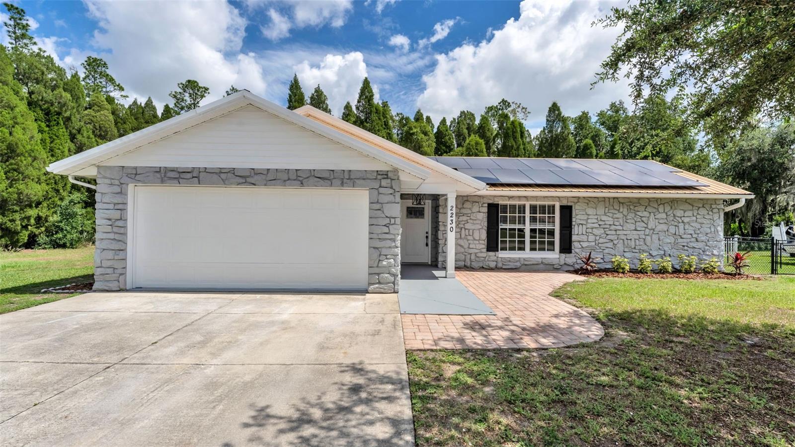Move in Ready 3 Bedroom/2 Bathroom/2 car garage single family home in Highland Lake Estates!! Home features formal living, formal dining & family room.  A large 17X28 air conditioned Florida room/bonus room that is perfect for entertaining. The tastefully remodeled kitchen features granite countertops, shaker cabinets & stainless steel appliances. Freshly painted interior & exterior.  Metal roof.  As an extra bonus the solar panels are paid off.  Large 12x32 detached workshop/shop with a new architectural shingle roof and new hardy siding.  Fenced backyard.  Plenty of space to park your boat/side by side and more.  This home is a must see.  Schedule your showing today.