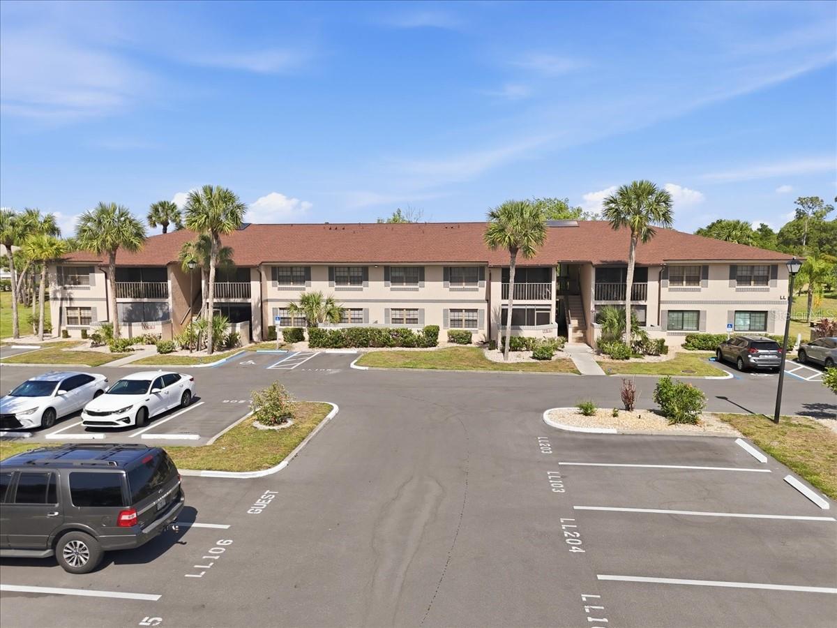 Welcome to Oaks IV — a peaceful, oak-canopied condominium community in the heart of Port Charlotte offering relaxed Florida living with resort-style amenities and a beautifully maintained park-like setting. This furnished first-floor 1-bedroom, 1-bath residence is ideally positioned with tranquil brackish canal views, pond views with a lighted fountain, and lush mature landscaping that create a quiet and inviting atmosphere.

Inside, you’ll find a bright and recently updated functional floor plan featuring an open living and dining area, updated ceiling fans with remotes, vertical blinds, updated flooring, fresh designer-inspired neutral interior paint, decorative dome-style ceiling panels, and comfortable furnishings included for immediate enjoyment. The dining area showcases custom built-in cabinetry with mirror accents and decorative chair rail detailing, adding warmth and character to the living space.

The kitchen features ceramic tile flooring installed in May 2018, luxury vinyl laminate installed in May 2026, a Whirlpool glass-top range, Hamilton Beach microwave, practical workspace, convenient appliance placement, and ample cabinetry. Kitchen is not designed in accordance with ADA guidelines.

The bathroom includes a Jacuzzi walk-in tub with grab bars, raised-height toilet, updated mirrors and lighting, and additional features designed for ease of use. Additional improvements include impact windows approved for Charlotte County hurricane standards, updated AC system and condenser, Rheem hot water heater installed January 2026, Honeywell digital thermostat, LG high-end combo washer/dryer, updated closet shelving, professionally cleaned grout, and a screened tiled lanai with HOA-approved storage cabinet.

Enjoy peaceful mornings and relaxing evenings from the screened lanai overlooking the canal, pond, and mature tropical landscaping with opportunities to observe native Florida birds and wildlife.

Residents of Oaks IV enjoy access to a heated community pool, clubhouse, bocce courts, shuffleboard, recreational facilities, seasonal community events, and beautifully maintained grounds shaded by mature Florida oaks. Conveniently located near shopping, dining, medical facilities, golf courses, Charlotte Harbor amenities, and beautiful Southwest Florida Gulf beaches, this residence offers an exceptional opportunity to enjoy the Florida lifestyle in a peaceful resort-style setting.

Monthly association fees are currently $316/month and include exterior maintenance, grounds maintenance, lawn care, water, sewer, trash, recreational facilities, and common area upkeep. Condo association approval required prior to ownership. One small pet may be permitted subject to association review and approval through the condo application process.

Buyers are encouraged to verify all measurements, features, furnishings, amenities, room dimensions, pet restrictions, leasing restrictions, and association requirements.