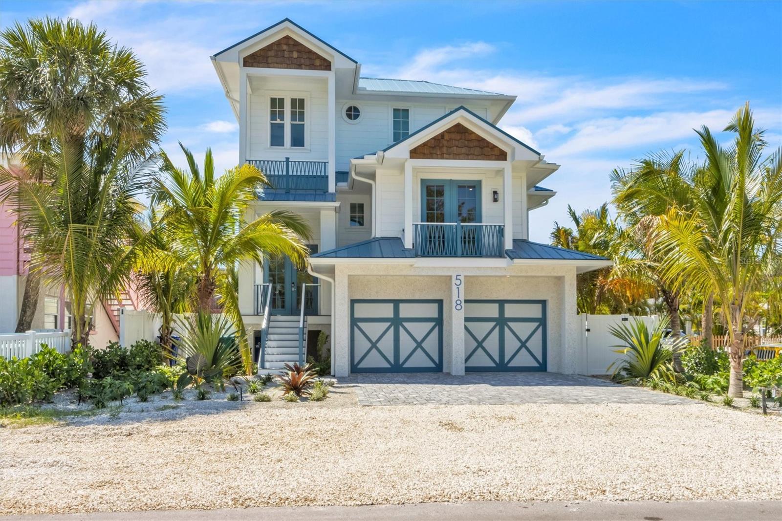 Dreaming of Island Living? This custom-built coastal home perfectly captures the essence of luxury island living on beautiful Anna Maria Island. This exceptional six-bedrooms, six-and-a-half-baths residence spans over 3,100 square feet and was thoughtfully designed with no expense spared or detail overlooked. The open concept living & dining space includes a chef inspired kitchen which boasts solid wood cabinetry, quartz countertops, and upgraded appliances. Each serene bedroom is its own private retreat, complete with ensuite baths, custom tilework, and spa-like features. Made for entertaining with expansive spaces to enjoy RELAXING inside OR out. Your private resort style backyard is a true sanctuary with a sparkling oversized heated pool and spa surrounded by lush landscaping and durable low maintenance turf with putt-putt golf.  A covered lanai and multiple balconies provide inviting spaces for relaxing, dining, and family fun. Whether you’re soaking up the sun poolside or enjoying the sunrise from the Bay AND sunset views from the Gulf from the rooftop deck, the outdoor living experience is unmatched. This coastal beauty will come completely Designer Turn-Key Furnished with upscale coastal finishes throughout. CURRENTLY A RENTAL PROPERTY WITH FORWARD BOOKINGS IN PLACE!!! This home is perfect for a full-time residence, vacation home or investment property and is ideally located on the North End of Anna Maria Island. Stroll one street over to beloved Pine Avenue and browse through the numerous shops and restaurants. The Bay and famous "almost rebuilt" Anna Maria City Pier are at the end of the street. AND the island's world-renowned Gulf beaches are a few blocks away. Hop on your bikes or golf cart to experience Anna Maria's full charm. Your ISLAND DREAM HOME AWAITS!
