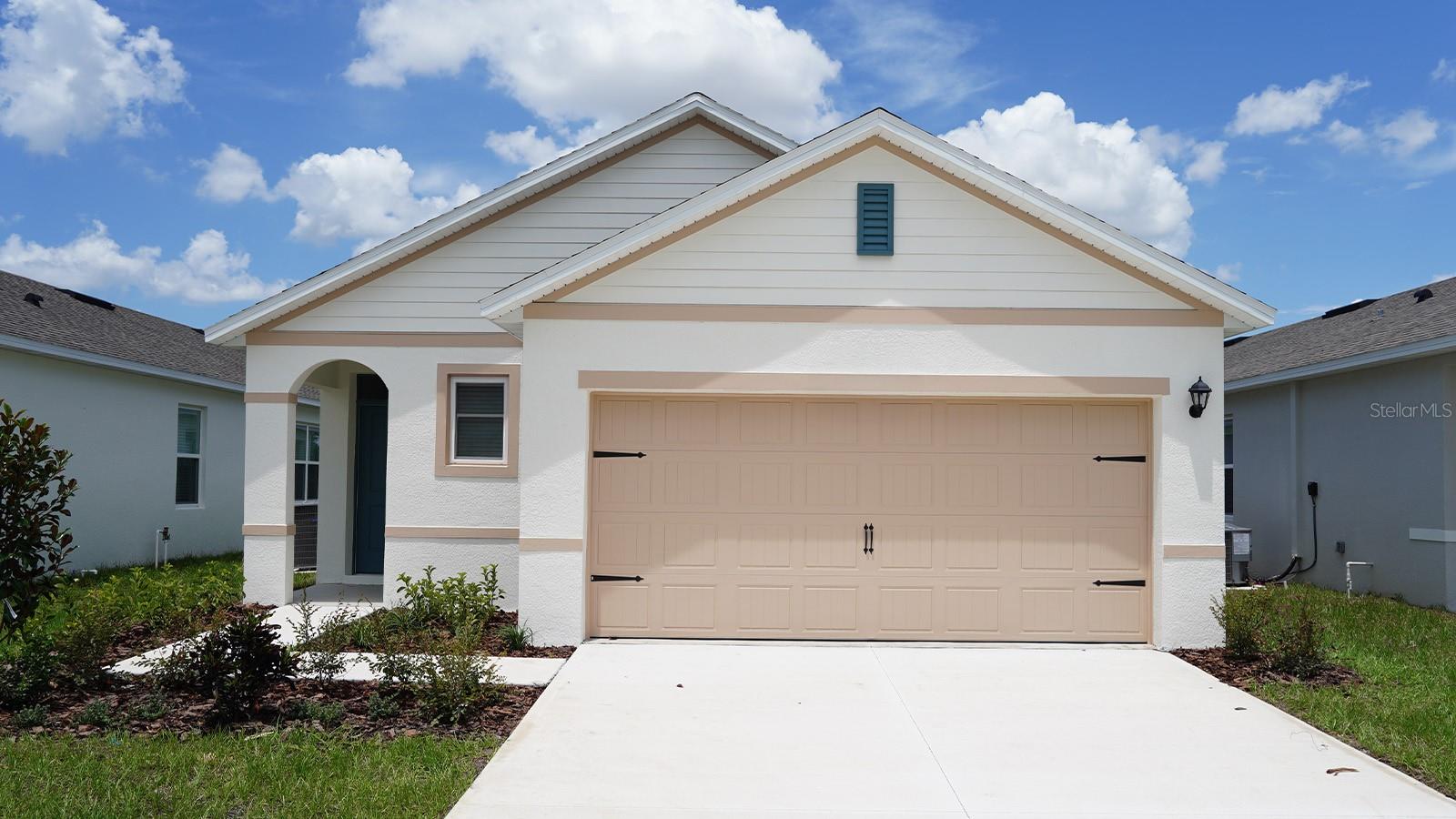 Under Construction. The Allex II is one of our one-story floorplans featured in Villamar in Winter Haven, Florida. With 2 exteriors to choose from, the Allex is sure to turn heads.

Inside this 3-bedroom, 2-bathroom home, you’ll find 1,504 square feet of comfortable living. The living area is an open concept, where your kitchen, living, and dining areas blend seamlessly into a space perfect for everyday living and entertaining. Relax on the covered lanai looking out to your backyard.

The kitchen features quartz countertops, stainless-steel appliances and a walk-in pantry which are sure to both turn heads and make meal prep easy. You’ll never be too far from the action with the living and dining area right there.

In every bedroom you’ll have carpeted floors and a closet in each room. Whether these rooms become bedrooms, office spaces, or other bonus rooms, there is sure to be comfort.

The primary bedroom located in the rear of the home has its own attached bathroom that features a walk-in closet and all the space you need to get ready in the morning. Sharing a sink isn’t a worry with the double vanity.

Like all homes in Villamar, the Allex II includes all concrete block and also smart home technology, which allows you to control your home anytime with your smart device while near or away.

Contact us today and find your home at Villamar.

*Photos are of similar model but not that of the exact house. Pictures, photographs, colors, features, and sizes are for illustration purposes only and will vary from the homes as built. Home and community information including pricing, included features, terms, availability, and amenities are subject to change and prior sale at any time without notice or obligation. Please note that no representations or warranties are made regarding school districts or school assignments; you should conduct your own investigation regarding current and future schools and school boundaries.*