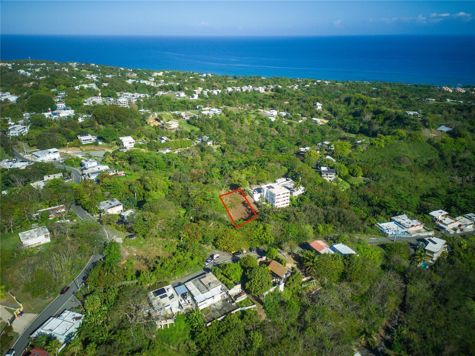 Exceptional opportunity to acquire a sloped homesite with ocean views in the highly desirable Rincón market. This property offers a compelling combination of coastal scenery, natural surroundings, and development potential, making it an attractive option for a custom residence, vacation retreat, or investment project. Conveniently located approximately 5.5 km from Road 413 and about 7 minutes from Sandy Beach, the site provides both privacy and accessibility to one of the area’s most sought-after coastal corridors. Utilities including water and electricity are available, and the property benefits from access via easement. The lot’s topography creates an excellent setting to design a structure that maximizes the unobstructed nature views. Nearby development in the area further supports residential use and future potential. Buyer to perform all due diligence regarding zoning, permits, access, utilities, and intended use.