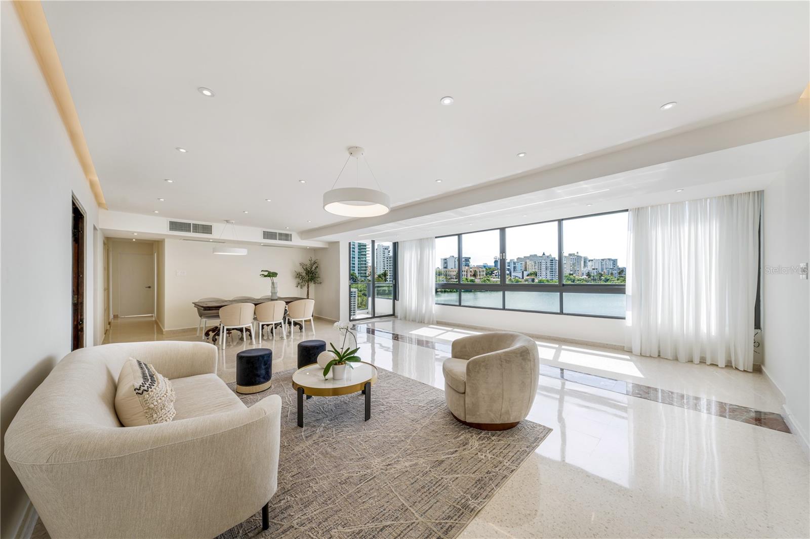 Elegant 3-bed, 3-bath apartment in Condado Beach with stunning lagoon views that serve as the ideal backdrop for a spectacular metropolitan lifestyle. This 4th-floor residence with approx. 1,740 Sq. Ft. affords top-quality windows and furniture, in addition to a modern kitchen with stainless steel appliances and an abundance of natural light in every space. The great room is tastefully furnished and seamlessly connects to the fully-equipped galley kitchen and balcony with scenic vistas. The primary bedroom is ensuite and features a generously sized layout. Contemporary design elements, an inviting atmosphere and one covered parking space complete and accent this exceptional home. Del Mar condominium offers residents coveted amenities such as a pool, basketball court, security, partial generator and water cistern. The building is desirably located just moments away from the best nightlife, fine dining, shopping venues and beaches. Del Mar is also within close proximity to Saint John's School and Robinson School. Condado Beach is a highly-esteemed community within the island's thriving capital. Near Isla Verde, Old San Juan and the Miramar Arts District. Experience city living in the Caribbean at its finest.