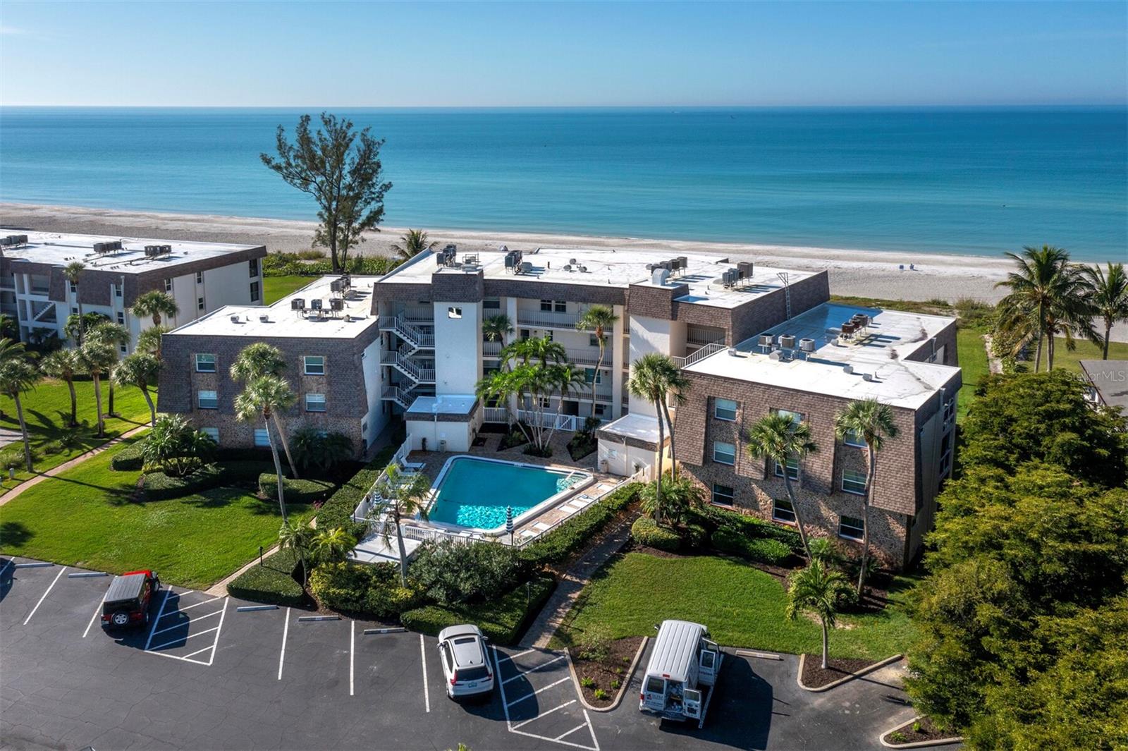Have you dreamed of the perfect island getaway situated right on a gorgeous stretch of beach on Longboat Key? This is by far the lowest priced direct beachfront condo on the entire island and it is already completely updated! Whether you decide to use it yourself or use it as an investment with outstanding monthly rental income availability, this is the one. With a fabulous ground floor location, you can have your toes in the sand in only a few steps! This condo offers Italian porcelain tile throughout and a completely new kitchen with beautiful counter tops, all new cabinets and new appliances. The bathroom has been beautifully updated as well and features custom tile work in a seaside theme. The view is fabulous in either direction with the sparkling pool out front and the gorgeous Gulf of Mexico out back. The open living and dining area allows plenty of space to entertain or to quietly contemplate whether it’s a beach day, a day for a soak in the pool or a walk to the Covert bayside fishing pier. The bedroom offers the same stunning beach view and features storm rated sliders to the screened in lanai. The midkey location allows for easy access to multiple restaurants and shopping. The tree filled mangrove trails of Joan Durante Park are a birders’ paradise and the 12 mile long bike path give you many options to soak in the sun while getting in your daily exercise. This is island living at its best at a price you may never thought you could find!