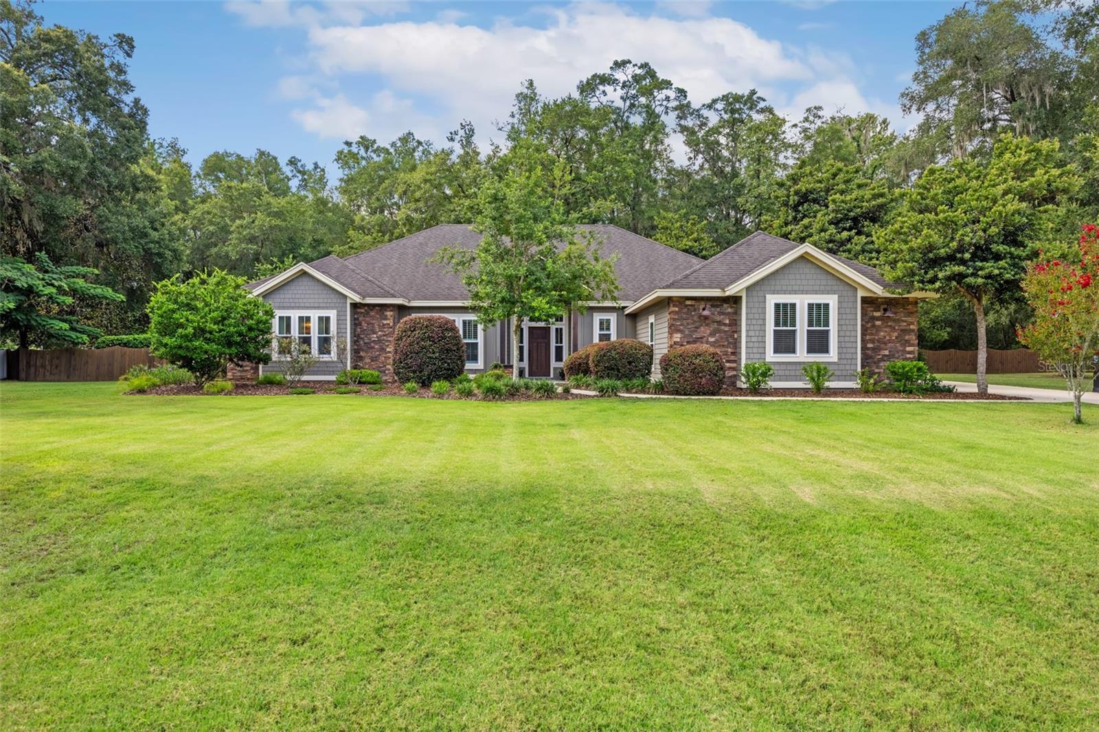 Welcome to this exceptional home in Parkwest Estates, where thoughtful design, spacious living, and resort-style outdoor amenities come together on a beautiful one-acre homesite.

This 4-bedroom, 3-bathroom home, built by Kara Bolton, also features a dedicated study, offering the flexibility for a home office, library, or playroom. The desirable split-bedroom floor plan provides privacy for the primary suite while maintaining an open, functional layout perfect for everyday living and entertaining.

At the heart of the home, you'll find a stunning oversized kitchen that seamlessly flows into the expansive living room. Soaring vaulted ceilings accented with beautiful wood beams create a warm, inviting atmosphere, while the open-concept design makes gathering with family and friends effortless.

Step outside to your own private backyard retreat. Enjoy year-round relaxation in the heated pool and hot tub, all overlooking the spacious one-acre property with plenty of room to play, garden, or simply enjoy the peaceful surroundings.

Located in Parkwest Estates community, this home offers the perfect balance of luxury, comfort, and space, all just minutes from the conveniences of Jonesville and Tioga. Don't miss the opportunity to make this incredible property your next home.