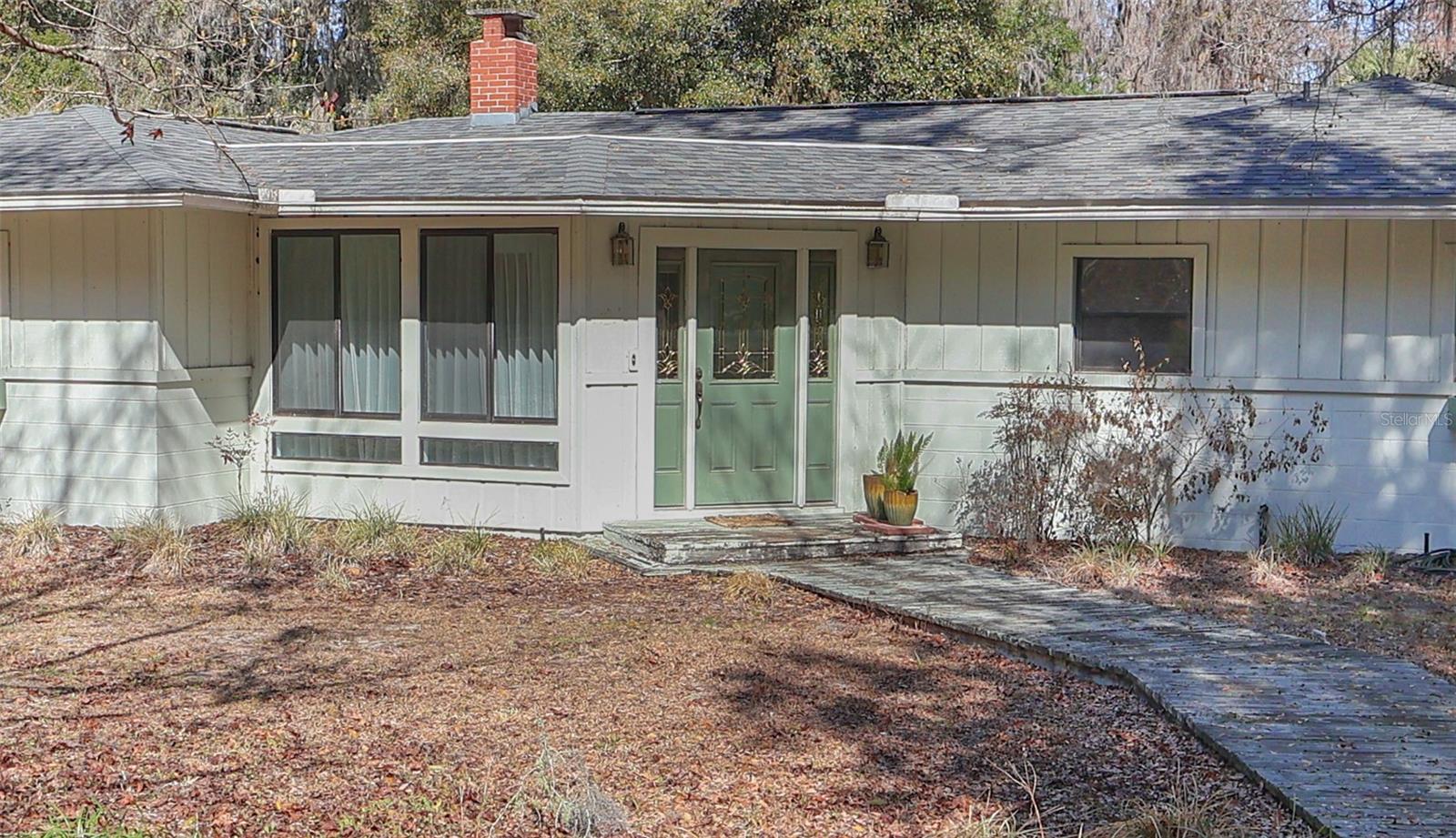 Located near the historic town of Melrose, this spacious 3-bedroom, 3-bath home sits on over 1.23 acres of lush and peaceful landscape. Deeded Access to Melrose Bay includes a 25ft easement with dock for access to Lake Santa Fe to enjoy beautiful views, fishing and kayaking. You are walking distance to small town charm to enjoy art galleries, restaurants, and parks. Open floor plan with lots of natural lighting. Kitchen is spacious and is open to a sunroom with nice built-ins. Nice Terrazzo flooring in main arears of the home are hidden under carpet! With generous living spaces and an ideal location, this home is a rare opportunity to enjoy both comfort and the vibrant lifestyle of downtown Melrose.
