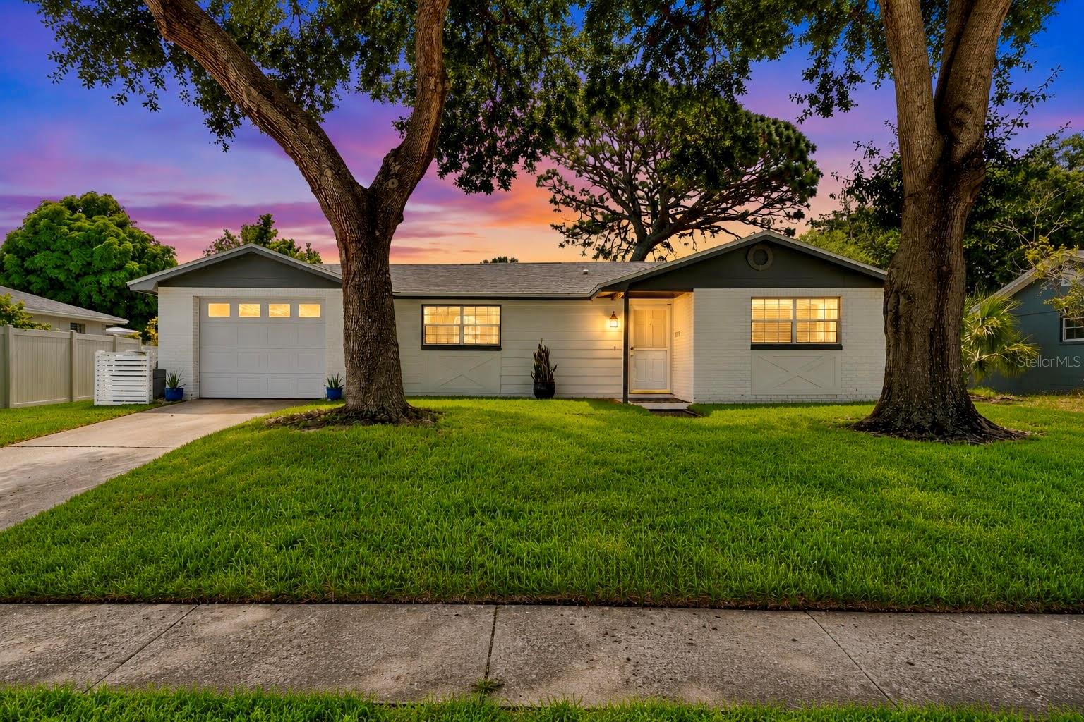 Welcome to this updated 3 bedroom, 2 bath home in the heart of Tarpon Springs! Nestled in a quaint neighborhood with NO HOA, this move-in ready home offers the perfect combination of comfort, style, and location.

Step inside to find an updated kitchen featuring granite countertops, stainless steel appliances, abundant cabinetry, and generous counter space—perfect for everyday living and entertaining. The living areas showcase easy care ceramic tile flooring, while all three bedrooms feature attractive luxury vinyl plank flooring.

The updated bathrooms have tasteful ceramic tile finishes, and the convenient inside utility room adds everyday functionality. Relax year-round in the large screened lanai overlooking the fully fenced backyard, complete with lush green grass (with the help of an irrigation system)—ideal for pets and/or family gatherings.

Major updates that provide peace of mind are a 2017 roof. New hot water heater 2026, New HVAC 2024, New irrigation pump and New Front Sod 2025, New garage door opener 2025

Located just minutes from some of Florida's most beloved destinations, you'll enjoy easy access to Fred Howard Park, Sunset Beach, and the world-famous Tarpon Springs Sponge Docks, known for waterfront dining, fresh seafood, boutique shopping, and rich Greek heritage.

Experience the vibrant lifestyle that makes Tarpon Springs so special. Stroll through the charming historic downtown filled with unique shops, art galleries, cafés, breweries, and restaurants. Enjoy the popular Tarpon Springs Farmers Market held on many Saturday mornings, along with the lively First Friday celebrations featuring live music, local vendors, food trucks, and family-friendly entertainment. Throughout the year, Tarpon Springs hosts festivals, art shows, and community events that create a true small-town atmosphere with a coastal flair.

Whether you're looking for a primary residence, seasonal retreat, or investment opportunity, this exceptional home offers an unbeatable location and a lifestyle you'll love.

Don't miss your opportunity to own a piece of one of Florida's most charming waterfront communities!