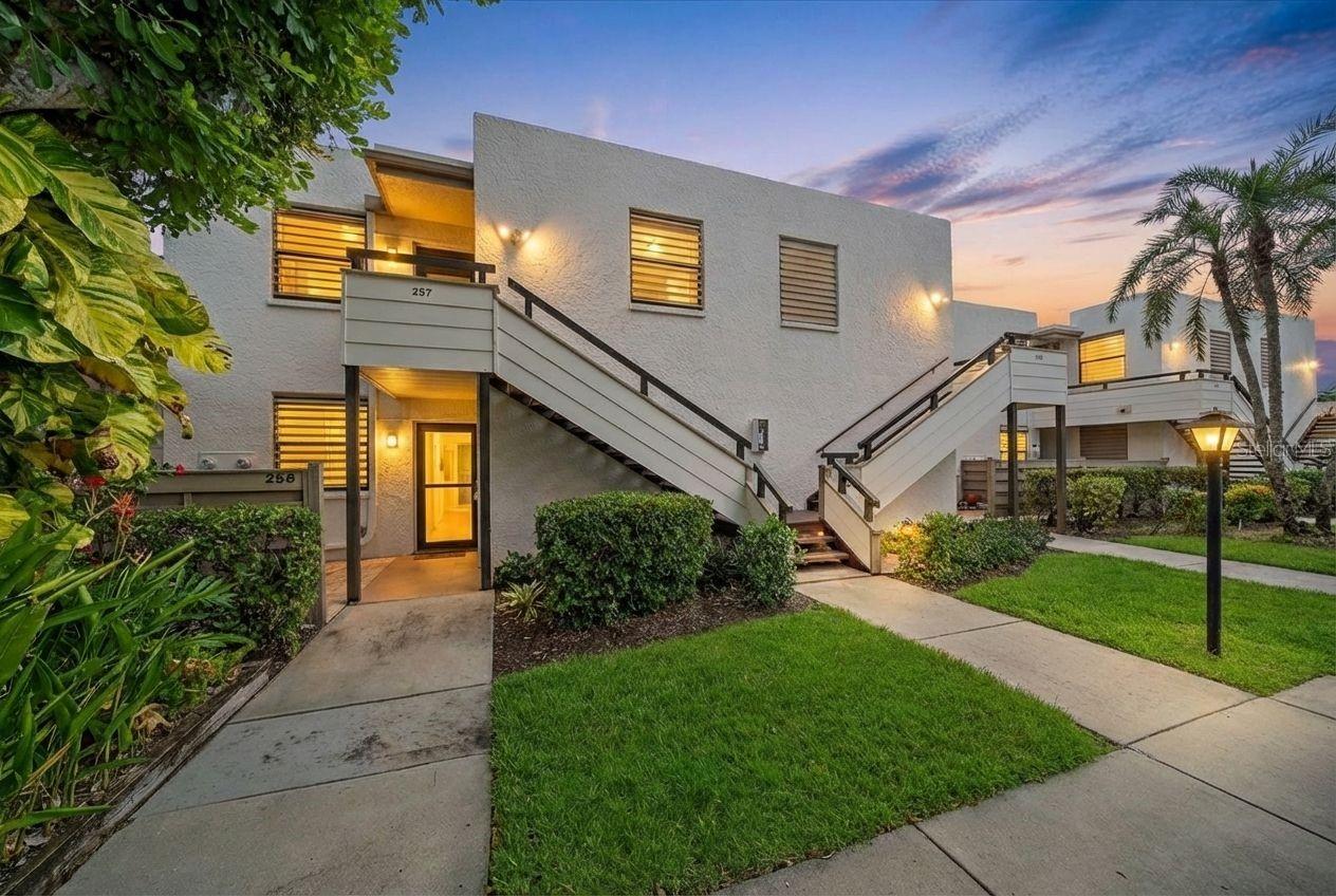 One or more photo(s) has been virtually staged. Turnkey furnished condo with deeded covered carport in one of Bradenton's most distinctive communities—welcome to effortless Gulf Coast living at Wildewood Springs.
This beautifully remodeled 2-bedroom, 2-bathroom villa-style condo offers a rare combination: genuinely move-in-ready condition, a coveted location minutes from Anna Maria Island, and a community setting unlike anything else on the Bradenton–Sarasota corridor. Whether you're seeking a furnished Florida retreat, a snowbird sanctuary, or a proven income-producing investment property near the Gulf beaches, this home delivers.
Wildewood Springs is no ordinary condo community. Designated a Florida Audubon Society Wildlife and Bird Sanctuary, the grounds are a living landscape—mature oak canopies, tropical plantings, winding lakeside paths, and resident wildlife that make every morning feel like a nature preserve. Seven heated pools, multiple spas, tennis, and pickleball round out amenities that feel genuinely resort-caliber, not just on the brochure.
Inside, a full renovation produced a light-filled, open-concept interior that feels fresh without feeling sterile. The designer kitchen features granite countertops, stainless appliances, subway tile backsplash, and shaker cabinetry. Updated flooring, crown molding, and refined finishes carry the quality throughout. Major systems have been addressed: HVAC is under three years old, water heater is brand new. Lightly used as a seasonal residence since renovation—this is true turnkey condition, not aspirational marketing language.
The primary suite opens to a private enclosed lanai wrapped in tropical greenery—a quiet place to start the morning, end the evening, or work remotely without staring at a parking lot. Both bathrooms have been renovated with tiled showers, granite counters, and contemporary fixtures. An oversized storage closet adds the kind of practical space furnished condos rarely offer.
HOA fees include high-speed internet, cable, water, sewer, exterior maintenance, pest control, and nighttime security. Pet-friendly. Professionally managed. Financials are strong. This is the lock-and-leave Florida lifestyle done properly.
Anna Maria Island, Holmes Beach, Longboat Key, IMG Academy, Downtown Sarasota, and SRQ Airport are all within easy reach. So is everything that makes this stretch of the Gulf Coast worth owning in.
Schedule your private showing today—Wildewood Springs is one of Bradenton's best-kept secrets!!