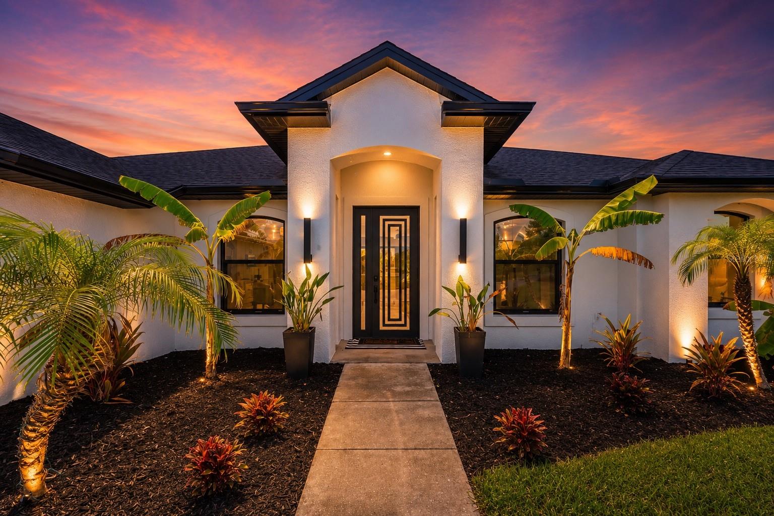 More than a home, this is your private resort, peaceful sanctuary, and a place where unforgettable memories are waiting. Rarely does a property come to market that so effortlessly combines luxury, privacy, craftsmanship, and timeless design. This is one of those rare opportunities.Completely reimagined 2024, to the studs and slab. This modern farmhouse estate sits on 4.75 private acres and offers the feel of a newly constructed custom home while preserving the character of an established estate. The extensive transformation includes expanding the home's footprint, converting the former garage into 4th bedroom/living space, and replacing virtually every major system, including the roof, HVAC, electrical, plumbing, insulation, ductwork, windows, and appliances. Natural light fills the open concept interior through striking black-framed windows, elegant 8-foot doors, French doors, and oversized sliding glass doors overlooking the resort-style pool and lush tropical landscaping. Luxury finishes inc Level 5 smooth drywall, high ceilings, quartz countertops, custom cabinetry with upper accent lighting, abundant storage, a built-in Sonos sound system in the kitchen and great room, tankless water heater, and smart home technology controlling interior/exterior  lighting and ceiling fans. The chef's kitchen is designed for everyday living and entertaining, featuring premium Café appliances, an oversized island w/a concealed pop-up charging station, expansive prep space, designer finishes, and lots of storage.
The primary suite is a private retreat featuring a tray ceiling, oversized walk-in closet, and sliding glass doors leading to a secluded patio surrounded by tropical landscaping-perfect for morning coffee or relaxing beneath the stars. The spa-inspired ensuite boasts a custom trough-style dual vanity, soaring ceilings, an oversized walk-in shower with 3 rain shower heads, a handheld shower, built-in bench seating, and designer finishes. The guest bath offers its own walk-in rain shower with body sprays.
A thoughtfully designed fourth bedroom offers exceptional flexibility as a guest suite, executive office, fitness room, media room, or creative studio.
Outside, everyday living feels like a luxury vacation. The newly resurfaced pool (2026) is finished with elegant glass tile and shimmering abalone shell accents, surrounded by expanded entertaining areas, mature tropical landscaping, and a stylish pergola-covered parking pavilion. A custom storage building complements the home's architecture while discreetly housing the well and pool equipment.
The impeccably finished barn reflects the same craftsmanship found throughout the estate, offering endless possibilities for equestrian pursuits, collector vehicles, fitness, hobbies, or additional storage.
Perfectly positioned for both privacy and convenience, enjoy being just 5 mins to Hal Scott and Wedgefield Golf Club, 15 mins to shopping and dining, 20 mins to Orlando International Airport, 26 mins to Lake Nona and Medical City, 30 mins to Downtown Orlando, 38 mins to Kennedy Space Center, 40 mins to Walt Disney World Resort, and 48 mins to Cocoa Beach, with quick access to SR 528.
Wake up to birdsong instead of traffic. Sip your morning coffee on your private patio. Spend afternoons poolside, evenings entertaining beneath the stars,weekends enjoying the very best of Central Florida before returning home to your own private retreat. Rarely available. Impossible to replicate. Welcome home.
