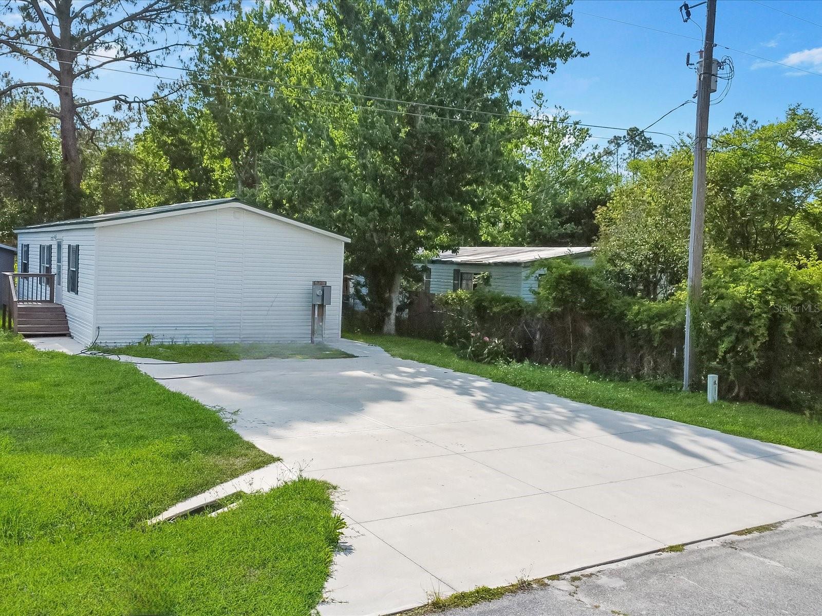 You do not want to miss this fantastic mobile home for first-time homeowners or investors! A double-wide mobile home that comes with its own land is amazing! In addition, the roof is metal, meaning it will be more durable than regular roofs. As you head inside you will see the freshly painted walls and the stylish interior. With three bedrooms and two bathrooms, this is a wonderful opportunity to own a home and land!