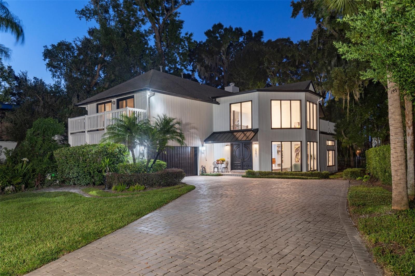 An incredible Winter Park Chain-of-Lakes opportunity on Lake Virginia with clear views of Rollins College. This transitionally designed home, situated in the highly coveted Virginia Heights, offers an opportunity like no other with proximity to Park Avenue coupled with the lakefront amenities through a Venetian canal system that uniquely connects five lakes and captures the quintessential Winter Park lifestyle. This four-bedroom three-and-a-half-bath home invites you into a two-story foyer surrounded by windows and natural light. The spacious kitchen features a mid-century tile backsplash, light cabinetry and a window out to the pool and lake. The main living space features a beautiful fireplace and back atrium that invites the stars and twinkling sunsets from the water. The separate dining room is spacious and there is an additional den or office space to round out the first floor. All bedrooms are upstairs and generously sized providing flexibility and the primary bedroom has the most incredible lakefront views. A clear water canal runs alongside the home and spills into lake Virginia adding to the ambiance of the backyard where nature abounds. Continue the existing renovation with your own style or build a house of your dreams. Impeccably located with shopping and dining at your fingertips as well as Rollins College. Fantastic schools with Audubon K-8 and Winter Park High. Don’t miss this one – call for your private tour.