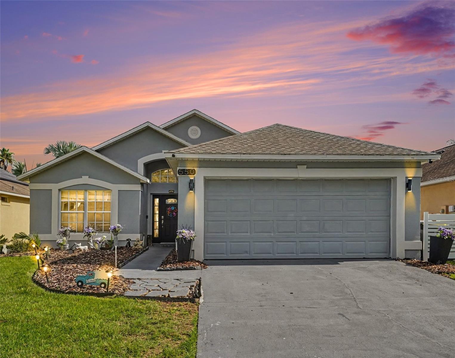 This 3-bedroom, 2-bath single-family home includes several practical updates that add value and flexibility. Seller-confirmed improvements include paid-off solar panels, an updated kitchen with newer appliances, a newer water heater, a water softening system, and French doors replacing the original sliding glass doors for direct access to the backyard.

The garage has been converted into a bedroom/studio, providing additional finished living space that can be used for a variety of needs. The home's updated kitchen and system improvements offer a solid combination of functionality and efficiency.

The backyard is easily accessed through the French doors, creating a convenient connection between the indoor living area and outdoor space. Located in Davenport, the property offers access to shopping, dining, major highways, and Central Florida attractions while being part of an established residential community.