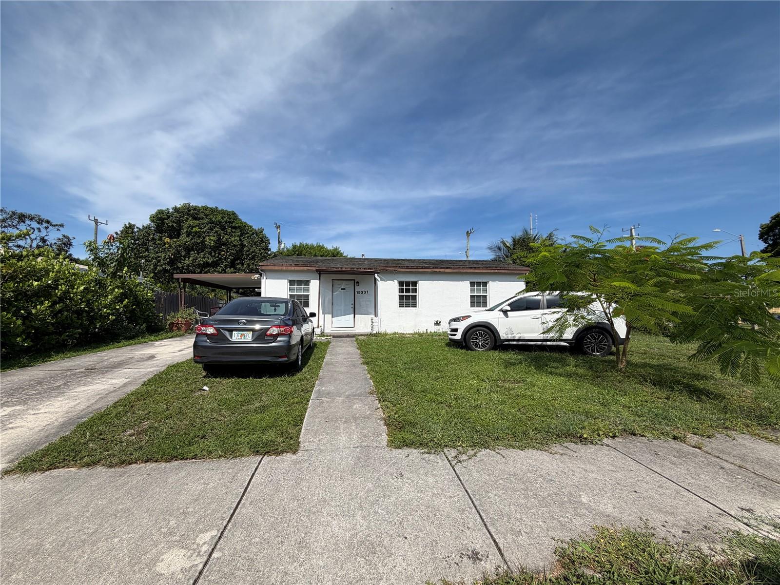 <HIGHEST & BEST BY 7/29/26> This is an INCREDIBLE INVESTOR SPECIAL OPPORTUNITY!! Welcome to this charming single-story home situated on a spacious corner lot in the heart of Miami Gardens. Offering 3 bedrooms and 1 beautifully renovated bathroom, this property is perfect for a quick fix-and-flip, long-term rental investment, or a savvy buyer looking to customize their ideal starter home.

                                                                                                                                                                                                          A covered carport, extended driveway, spacious front yard, and oversized side yard provide ample parking and endless potential. Mature trees add charm, shade, and privacy. Inside, an open-concept living area features wood flooring, crown molding, recessed lighting, and abundant natural light. The updated kitchen boasts solid wood cabinetry, granite countertops, a glass tile backsplash, stainless steel appliances, and a convenient breakfast bar. The generously sized bedrooms are bright and versatile. One room, previously a bathroom, has been converted back into a compliant bedroom to satisfy city requirements, making it ideal as a home office, nursery, gaming room, or hobby space. The beautifully renovated bathroom features floor-to-ceiling designer tile, mosaic accents, a modern vanity, updated fixtures, and a sleek tub/shower combination for a spa-inspired finish.
                                                                                                                                                                                                          A separate addition is located just off the kitchen, though the original access has been enclosed. The structure is missing a portion of the roof, offering an opportunity to restore or reconfigure the space. Buyer should independently verify whether the addition may be legalized, permitted, modified, or require demolition.

                                                                                                                                                                                                        The oversized backyard offers exceptional space and flexibility, complete with mature shade trees, multiple patio areas, a cozy fire pit, an outdoor laundry room, and a detached storage shed. Whether you envision a pool, expanded outdoor living, future additions, or simply enjoying the generous yard, this outdoor space is ready to bring your vision to life.

                                                                                                                                                                                                       The A/C is approximately 4 years old and operating well. Electrical and plumbing are functioning properly. Roof age is unknown and has not been replaced since at least 2018. If the City of Miami Gardens requires a re-occupancy inspection, the property may not qualify in its current condition, and Buyer should verify with their lender whether financing will be permitted or whether the re-occupancy requirement can be waived. With no HOA and no rental restrictions, this is an exceptional opportunity for investors and owner-occupants alike. Property is being sold strictly AS-IS, and Buyer shall rely solely on their own due diligence regarding the addition, financing requirements, and any applicable municipal requirements.