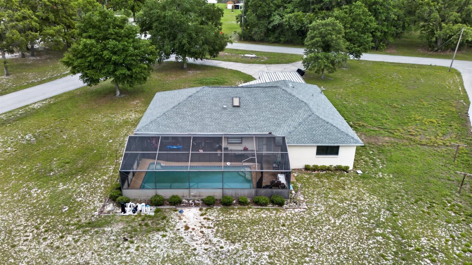 Auction Property. LIST PRICE IS FOR MLS PURPOSES ONLY. ACTUAL PRICE WILL BE DETERMINED AT AUCTION. ONLINE AUCTION ENDS AUGUST 5 AT 11:30 AM ET. This 3± bedroom, 2± bathroom home with 1,816± sf is situated on a 1 acre lot. The home includes a pool with screened enclosure, 2-car garage, shed and RV/carport canopy. The concrete block stucco home was built in 1986± with a newer hip roof (2023±). The property is located in flood zone X (area of minimal flood hazard) with no HOA or CDD. Corner lot with circular drive provides access to/from both streets. Private setting but very close (1± mi) to restaurants, retail, and services on SR-52. Conveniently located: 6±mi to Hudson Beach, 30±mi to Clearwater, 40±mi to Tampa. Currently occupied - please do not disturb tenants. Property #: DG26033-2. Bid Online July 29 - August 5. Sale is subject to approval by the United States Bankruptcy Court for the Middle District of Florida in Case No. 8:26-bk-01636-CPM. 10% Buyer's Premium.