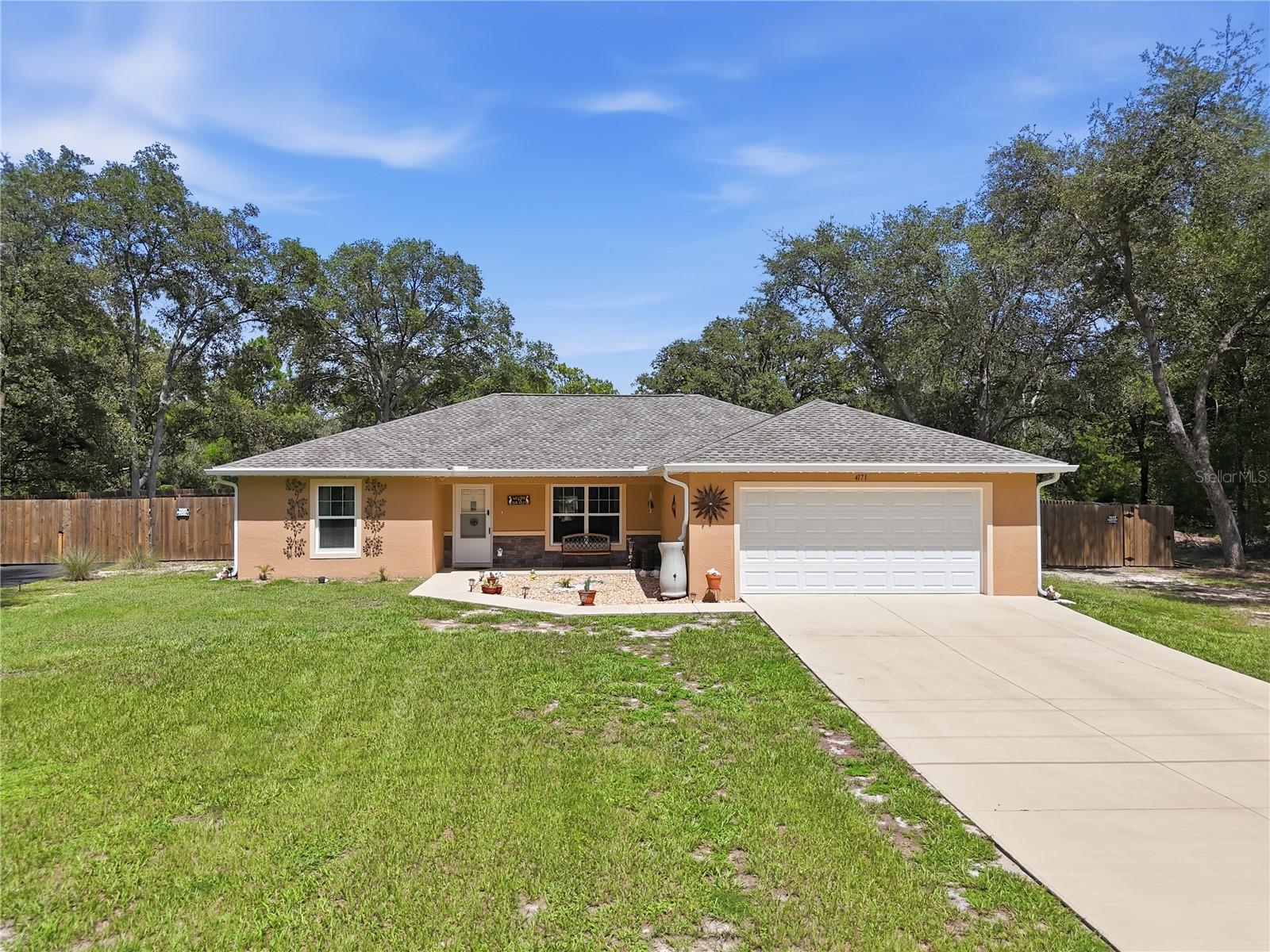 Virtually Staged. Welcome to this beautifully maintained home offering the perfect combination of comfort, functionality, and outdoor living on a spacious homesite in Dunnellon. From the moment you arrive, you’ll appreciate the thoughtful upgrades that make this property truly stand out.
Inside, you’ll find a bright and inviting floor plan designed for everyday living and entertaining. Step outside to your own private backyard retreat featuring an impressive 18’ x 33’ above-ground pool, an extended concrete patio, and a covered porch complete with misting systems to help keep you cool on warm Florida days. The garage floor and rear porch have been professionally finished with durable Shark Coating for both beauty and longevity.
This property is ideal for hobbyists, RV owners, or anyone needing extra outdoor functionality. A paved asphalt driveway leads to the rear of the property, providing easy access to two additional concrete patios and a large insulated shed equipped with electricity and air conditioning. The property also features a dedicated RV hookup, a generator-ready electrical box, six exterior water spigots, and convenient pool storage with an electric pool vacuum system.
Additional improvements include gutters with leaf guards for easy maintenance and excellent access to the rear of the property, offering endless possibilities for storing recreational vehicles, trailers, or creating additional outdoor living space.
If you’ve been searching for a home that offers more than the standard builder features, this one is a must-see. Schedule your private showing today!