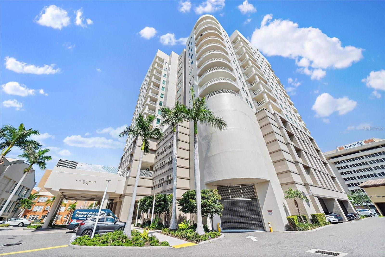 One or more photo(s) has been virtually staged. Offering an unmatched combination of structural peace of mind, a walk-to-everything downtown lifestyle, and rare perks like two secure parking spaces, this meticulously updated residence represents the ultimate value play in Sarasota’s luxury market and demands an in-person tour.

DOWNTOWN VALUE & PRIME LOCATION | 2-BR + DEN | SECURE MODERN CONSTRUCTION

For the buyer seeking the perfect intersection of strong value, a walk-to-everything location, and the structural integrity of a newer building, Residence #703 at Rivo at Ringling delivers on every front. Built in 2006, this 16-story contemporary tower stands out in downtown Sarasota for its modern concrete construction, excellent building health, and a fully funded reserve—offering rare peace of mind and long-term financial security. Encompassing just 106 residences around a dramatic, light-filled central atrium, Rivo offers an intimate, well-managed community feel with lower fees and better value per square foot than surrounding new construction, all while placing you steps from the city's best dining, theater, and waterfront.

Inside, this meticulously updated 2-bedroom plus den, 2-bathroom residence offers an effortless, move-in-ready transition with both bedroom sets fully included in the sale. 

The bright, open-concept floor plan features a freshly modernized chef’s kitchen with sleek quartz countertops, a full-height seamless backsplash, custom stacked cabinetry, and stainless steel appliances. Expanses of glass open to an impressive, oversized 20x9-foot north-facing terrace, extending your living space outdoors for alfresco dining against a backdrop of the city skyline and a glimpse of Sarasota Bay. 

This split-bedroom layout ensures maximum privacy for guests, while the flexible custom den easily functions as a home office, media room, or a third sleeping space. Serving as a quiet retreat, the primary ensuite is complete with direct terrace access, a large walk-in closet, and a spa-inspired ensuite bathroom featuring a frameless glass shower and premium modern finishes.

Practical efficiency and convenience are woven throughout the property, from the interior peace of an exterior-facing AC closet with a UV air-purifying system to a wealth of rare downtown parking assets. 

This residence includes an exceptionally rare commodity in downtown living - two oversized, under-building parking spaces in a secure gated garage! Also included is a private storage room, secure bike and kayak storage, and available EV charging stations. 

Rivo at Ringling further elevates its value proposition with resort-style amenities, including concierge services, a heated pool and spa with a sun deck, a covered grilling terrace, a state-of-the-art fitness center, and a pet-friendly policy with flexible rental guidelines. Combining a high-quality newer build, fully funded financial health, and a partially furnished (bedrooms only) head start in the heart of downtown, this residence represents an unmatched value play in Sarasota’s luxury market.

Easy to view and easier to fall in love with Rivo and this 7th floor property.