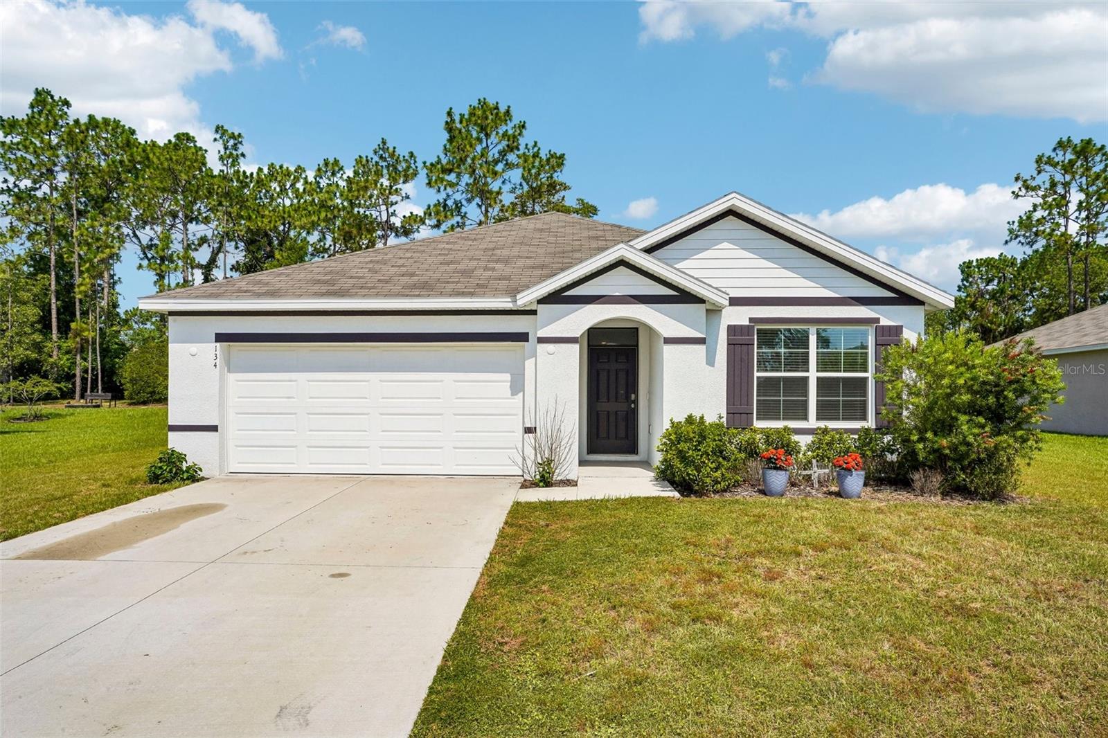 Short Sale. Welcome to Lake Diamond North, one of Ocala's desirable golf course communities! This nearly new 2024-built home has been barely lived in and offers a rare opportunity to purchase an approved short sale with the bank approval already in place.

Featuring 3 bedrooms, 2 bathrooms, and 1,670 square feet of thoughtfully designed living space, this home boasts an open-concept floor plan perfect for both everyday living and entertaining. The spacious kitchen overlooks the living and dining areas and includes stainless steel appliances, ample cabinetry, and modern finishes.

The primary suite offers a private retreat with an en-suite bath and generous closet space, while the additional bedrooms provide flexibility for family, guests, or a home office. An indoor laundry room adds convenience and functionality.

Step outside and enjoy peaceful views as the property backs directly to the executive golf course, creating a beautiful backdrop with no rear neighbors. Located in the sought-after Lake Diamond North community, residents enjoy a convenient Ocala location close to shopping, dining, schools, and outdoor recreation.  Lake Diamond is located within the Lake Diamond golf community in southeast Ocala, known for its golf course setting and convenient access to area amenities.

Don't miss this opportunity to own a like-new home at an exceptional value in a golf course community. Schedule your private showing today!