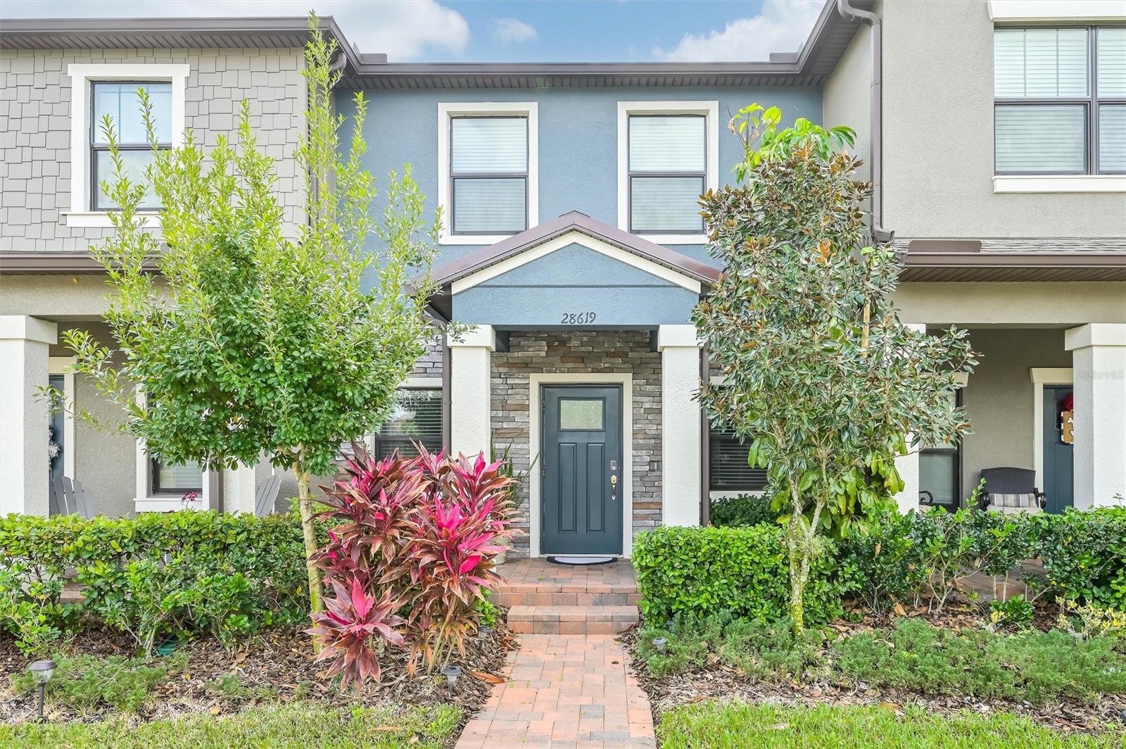 Enjoy the good life in this well-maintained 2 bedroom, 2.5 bath, Wiregrass Ranch Townhouse. Great open floor plan encompassing living and dining area, perfect for entertaining. Inspire your culinary genius in the large open kitchen featuring granite countertops, breakfast bar and plenty of prep space. The laundry room and half bath complete the first level. The second level hosts a generous Owner's suite with walk in closet and bath with double sinks as well as the guest suite with private bath. Relax or entertain in the private fenced courtyard style back patio, located off of the kitchen. Garage is located on the back of the home and opens into the courtyard. Wiregrass Ranch offers a community pool, dog park and walking trail around the community. This is maintenance free living at its best! ;Water: City