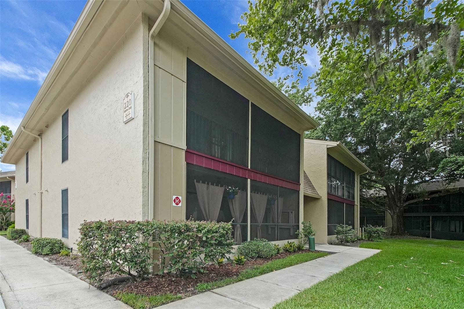 Virtually Staged. Not every condo feels like HOME the moment you walk in—but this one does. EXCELLENT CONDITION! Tucked beneath the canopy of mature oaks in The Highlands of Winter Springs, this beautifully UPDATED FIRST FLOOR ONE BEDROOM/ONE BATH condominium offers the perfect blend of comfort, convenience, and carefree Florida living. Forget carrying groceries upstairs or tackling weekend projects. This move-in ready home has ceramic tile flooring throughout the main living areas, new luxury vinyl in the bedroom, new appliances, updated lighting, modern ceiling fans, a new water heater - A/C system replaced in 2019. The bedroom features custom-built closet organizers that maximize storage, while two additional exterior storage closets provide room for bicycles, holiday décor, tools, and outdoor gear. In 2010 all interior elements of the building were replaced with new electric, plumbing, doors, windows and all drywall and studs. One of the home's best features is the oversized screened porch—a private outdoor living space where you can sip your morning coffee, read a book, or unwind at the end of the day while enjoying the peaceful, tree-lined setting that has made The Highlands one of Winter Springs' most beloved communities. Life here extends well beyond your front door. Residents enjoy miles of scenic walking and nature trails, a community pool, tennis courts, pickleball courts, clubhouse, playground, and beautifully landscaped common areas that encourage an active outdoor lifestyle. Whether you're taking an evening stroll beneath the oak trees, meeting neighbors for a game of pickleball, or spending the afternoon poolside, you'll quickly see why so many people love calling The Highlands home. Located in the heart of Winter Springs, you'll be just minutes from top-rated Seminole County schools, shopping, dining, medical facilities, parks, and major roadways including SR 434, SR 417, and US 17-92, making commuting to Orlando, Winter Park, Lake Mary, and the surrounding area simple and convenient. Whether you're searching for your first home, a winter retreat, an investment property, or an easy, low-maintenance lifestyle, this updated Winter Springs condo delivers exceptional value in a location that continues to be one of Central Florida's most desirable places to live.