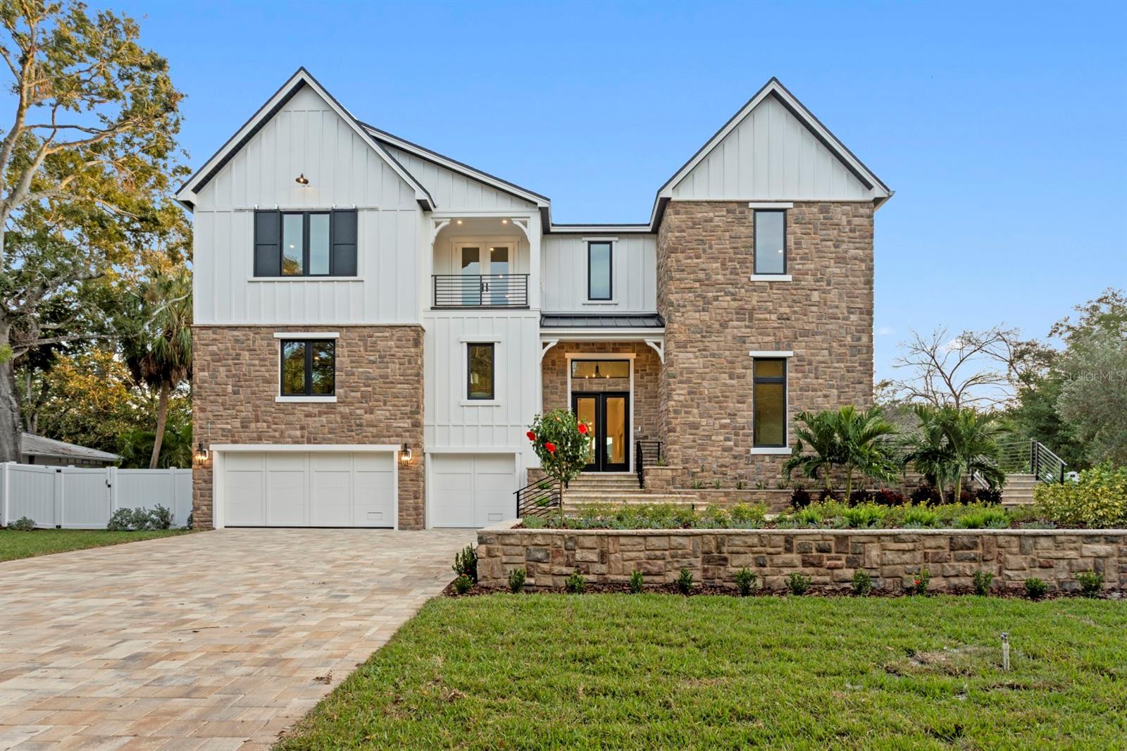 Brand new construction on a rare 120x150 double lot in Sunset Park - space to stretch out, entertain, and truly live. This transitional luxury home by Adobe Homes balances design and comfort beautifully, with soaring ceilings, walls of windows, and tranquil greenery views that set a calm backdrop for everyday life. The dramatic tiered front and backyard showcase the expansiveness of the 18,000+ SF property.

The heart of the home is a magazine-worthy kitchen featuring a dramatic double-island layout, Wolf/Sub-Zero appliances, quartz counters, picture-frame windows, and a stunning butler's pantry. Multiple flexible living spaces offer room for everyone: a private first-floor guest suite tucked away for comfort and privacy, a dedicated office with its own terrace, a loft and upstairs bonus room with wet bar ideal for media, play, or fitness, and an elevated theater/bonus level that's quiet and separate for focused use.

The primary suite feels like its own retreat with a private balcony overlooking the resort-style backyard, a spa-inspired wet room with soaking tub and rain shower, and a massive closet. Outside is where this home truly stands apart - a huge pool and spillover spa with automatic floor cleaners, expansive pool deck, wide green lawn, lush privacy landscaping, and a covered lanai with gas fireplace and outdoor kitchen, all surrounded by mature trees.

Additional notable features include impact-rated windows and doors, a built-in elevator shaft, custom millwork, smooth drywall, wide-plank flooring, smart wiring, and a three-car garage with epoxy floors. Move-in ready and perfectly located within short walking distance to Mabry, Coleman, and St. Mary's, and zoned for Plant High School.

4624 W. San Jose St - where elevated luxury meets everyday living. Welcome home.