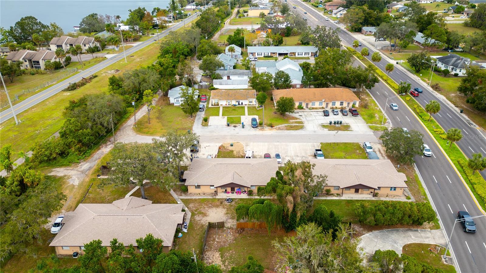 The Lakeshore Portfolio, a diverse collection of multifamily properties located in Lake Alfred, Polk County, Florida. This portfolio consists of seven properties situated along Lakeshore Way and David Avenue, comprising a total of 28 units on 2.30 acres, all in adjacent parcels.

The properties feature a mix of concrete block and wood-frame construction, each with pitched shingle roofs. The portfolio offers a range of unit configurations, including studios, one-bedroom, two-bedroom, and three-bedroom options, accommodating varied tenant needs. Built between 1920 and 1984, each property maintains its distinct character and quality.

Each unit is sub-metered for both electricity and water, with tenants responsible for their own utilities. Water is provided by the city, while each building has its own septic tank system.

The Lakeshore Portfolio represents an excellent investment opportunity with stabilized utility management, low-maintenance septic systems, and solid construction across multiple building types and unit configurations. Its diverse unit mix and reliable infrastructure make it a prime acquisition for investors seeking both stability and potential growth in Lake Alfred’s multifamily market.
