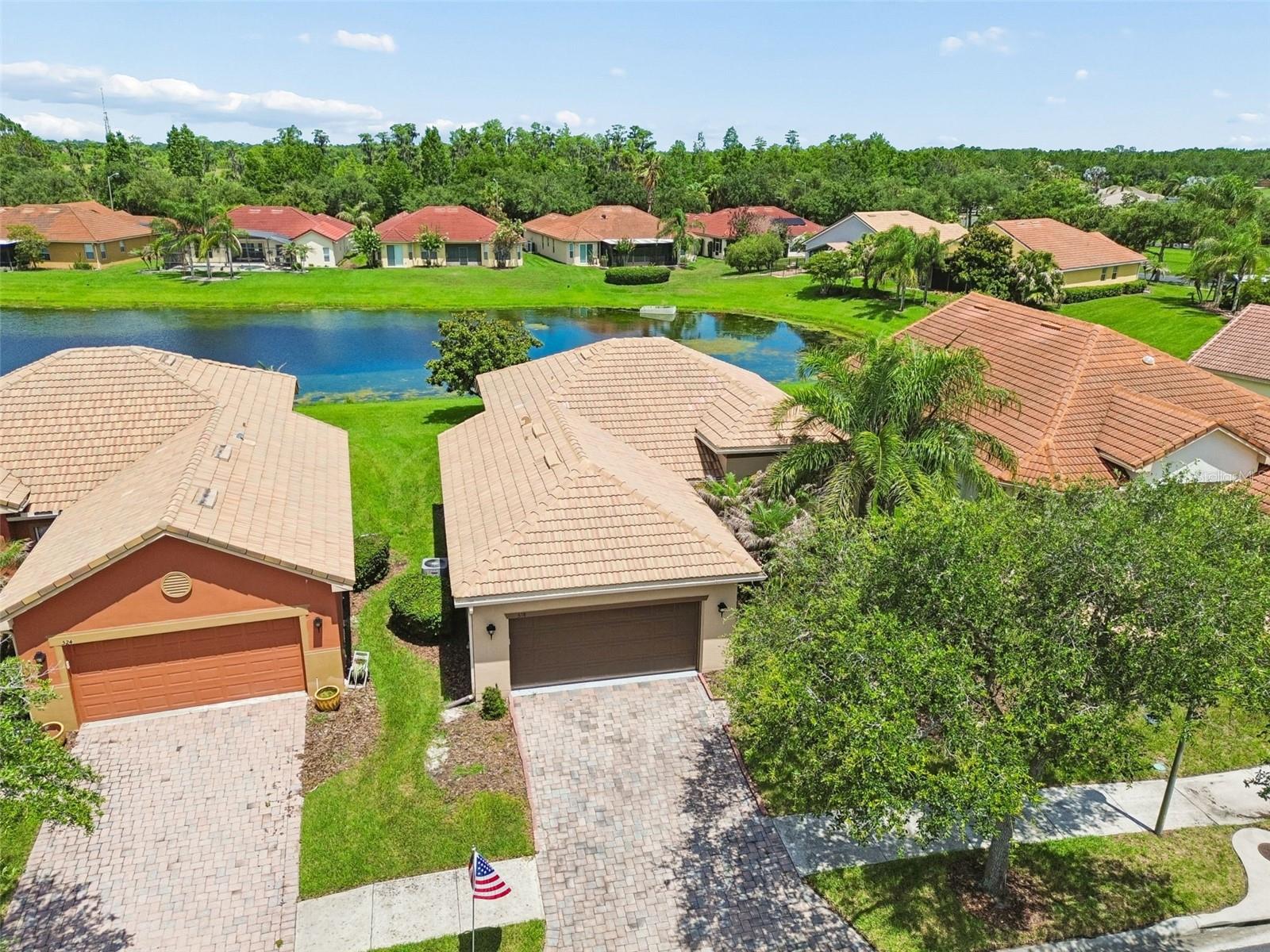 Enjoy breathtaking water views from this beautifully maintained custom 2-bedroom, 2-bath home with a versatile den/study, located in a quiet section of Solivita, Central Florida's premier 55+ active adult community. Offered by the original owner, this move-in-ready residence features a desirable split-bedroom floor plan and absolutely no carpet, with ceramic tile and luxury vinyl plank flooring throughout. The spacious living room is filled with natural light and showcases expansive pond views through sliding glass doors that open to the extended screened lanai. The  open kitchen is designed for both functionality and style, featuring Quartz countertops, solid wood cabinetry, newer appliances, and ample workspace. The dining area also enjoys serene water views and direct access to the lanai, making it perfect for indoor-outdoor entertaining. The primary bedroom suite is a peaceful retreat with a sitting area overlooking the water, while the en-suite bath offers a large walk-in shower and generous storage. On the opposite side of the home, guests will appreciate their own private bedroom and bath. The guest bedroom includes a built-in desk and Murphy bed, providing flexibility for visitors or a home office. The den/study serves as an ideal office, hobby room, or additional flex space. Relax on the tiled screened lanai while enjoying picturesque pond views and abundant wildlife. The oversized backyard provides plenty of room to install a fence for your furry family members. Additional features include a 2-car garage with abundant storage space and golf cart hookups, a security alarm system, built-in safe, and a 2019 HVAC system. This exceptional waterfront home combines comfort, functionality, and stunning views in one of Solivita's most desirable locations. Solivita is a premier 55+ community, offering residents an exceptional lifestyle with state-of-the-art amenities. Enjoy a fully 2 equipped fitness centers, dance and aerobics studios, and an impressive array of recreational options including 14 heated swimming pools, two heated spas, tennis courts, pickleball courts, shuffleboard, bocce ball, billiards, and an art gallery. The community also features three on-site restaurants and two championship 18-hole golf courses. With a full calendar of activities and events, there’s always something new to explore and enjoy. This home is conveniently located near a hospital and medical office complex, and shopping center.