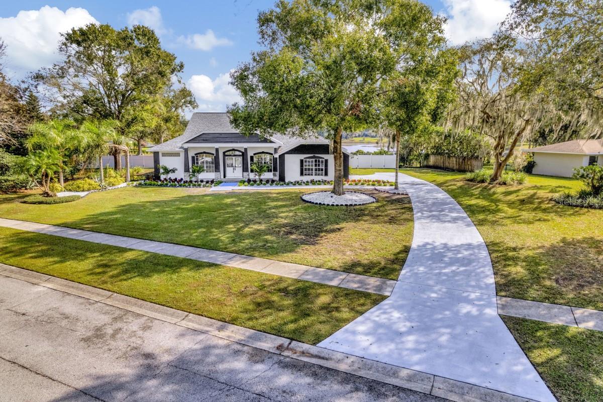 Welcome to your dream lakefront oasis! This stunning, fully renovated split floor plan 4-bedroom, 3-bathroom home sprawls across an expansive 60k sqft lot. Nestled in a tranquil, nature-rich environment, this property boasts breathtaking views of a serene lake from the kitchen, living room, and master bedroom.
Step inside to discover a completely modernized interior featuring a brand new kitchen and bathrooms adorned with luxurious quartz countertops that waterfall quartz down the oversized island. The master bathroom indulges with a double shower wrapped in giant floor-to-ceiling marble tiles, offering a spa-like retreat within your own home.
Entertain in style with a formal dining room, or simply unwind in the large open floor plan designed for both comfort and functionality. The heart of this home is its massive screened-in pool, inviting you to relax in privacy while enjoying the picturesque views and the occasional visit from majestic crane birds.
Brand new HVAC system
2 car garage with over 100ft of driveway space.
This property offers the perfect blend of tranquility and accessibility - a peaceful sanctuary in a relaxing, quiet area while still being conveniently close to an array of restaurants and shopping options on SR54.
Located just 30 minutes away from TPA airport, this gem combines the allure of a secluded haven with the ease of reaching essential amenities. This is a must-see in person! Don't miss the chance to make this stunning retreat your new home!