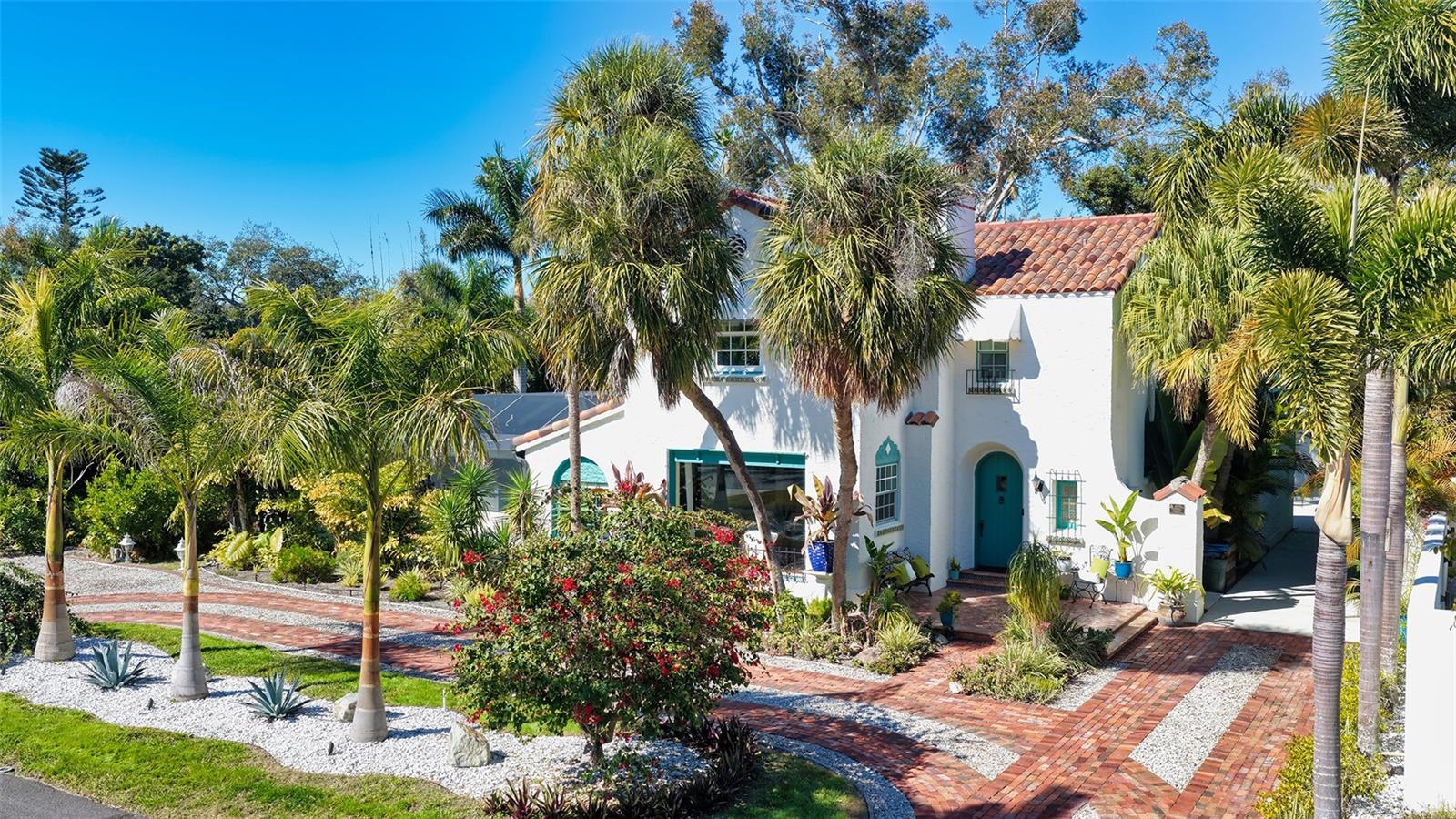 Exquisitely restored 1926 residence in Sarasota’s historic Museum Area west of the Trail. This architectural gem is one of just 13 original platted homes in the historic Sapphire Shores subdivision. Originally built for John Ringling’s circus talent scout, this home represents one of the best examples of true Mediterranean Revival architecture on the market. Set on an oversized 0.40-acre double lot located out of the flood zone and at 15 feet of elevation, this 3,100 sq ft home comprises 3 bedrooms, 2.5 bathrooms plus a sunroom/den in the main house and a 1 bedroom 1 bath detached guest house - 3,100 sq ft in total. The home is located on one of the coveted wide streets leading to the bayfront park. The traditional Mediterranean façade is framed with lush landscaping and a circular reclaimed brick driveway leading up to a beautiful arched entryway. The current owners have invested extraordinary time, vision, and craftsmanship into restoring and refining this 101-year-old architectural treasure. True to its historic character with its elegant arched doorways to intricate tilework and exposed original tile brick, the home also benefits from thoughtful updates that support modern living without compromising its integrity. An extensive 2017 remodel created a bigger kitchen, added a butler’s pantry/laundry room, new roof, new plumbing and electric, and new bathrooms. The owners added approximately 2,000 sq ft of outdoor living space with a beautiful Spanish-inspired covered lanai with space for eating, lounging and entertaining and a large pool deck with panoramic screens. The yard is a true gardener’s paradise, featuring multiple curated garden beds, a wide variety of plant and tree species, and a beautifully designed succulent garden bordering the front of the home. The two-car garage is currently used as a workshop/workout room but can be easily converted back to a garage.  This is a rare opportunity to own a piece of Sarasota’s architectural history, thoughtfully restored, beautifully enhanced, and ready for its next chapter. This beautiful home is located just south of the Ringling Museum and Asolo Theater and is a short walk from a beautiful neighborhood park by the bay where locals gather to fish, watch the sunset, practice yoga and walk their dogs. Indian Beach Sapphire Shores is minutes from downtown Sarasota, Lido Beach, and St. Armands Circle. The home is perfectly positioned near Ringling College of Art, New College, and the North Trail’s growing selection of independent restaurants, coffee shops, and pubs.