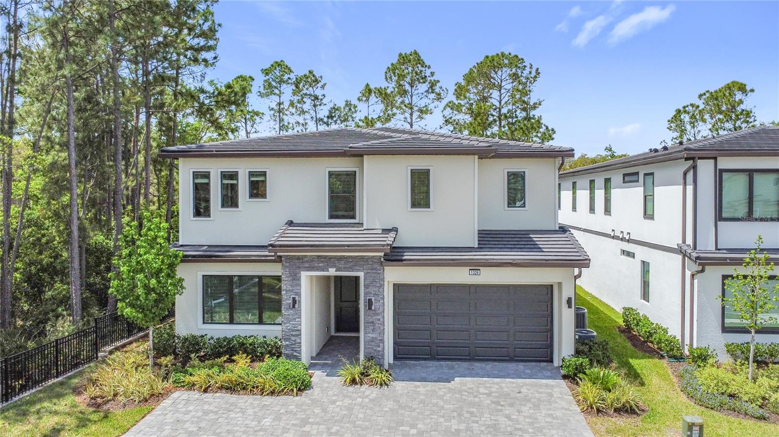 Discover luxury living in Exclusive Watersong Community , Davenport,Fl. Welcome to this amazing, never-lived-in home located in the wonderful Watersong Resort, zoned for short-term rentals. Indulge in the epitome of opulence with our exquisite 12-bedroom 11 and half baths , Almost full furnished home, tailor-made for the discerning vacation market.  The kitchen is a culinary heaven, equipped with double sinks, double refrigerators, double microwaves and double dishwashers. This property offers the perfect blend of luxury, comfort, and investment potential.  Outdoor kitchen hookups, perfectly suited for seamless hosting and entertaining experiences next to the luxury pool and spa, Relish the luxury of abundant space and comfort, creating an unparalleled sense of exclusivity. Seize the opportunity to explore this gem—a home that effortlessly marries sophistication with functionality, an absolute must-see for those with discerning tastes. Enjoy access to all the community facilities and amenities including clubhouse, tennis court, resort-style community pool, and a fitness center . Located in the best lot of the community, corner, in an amazing cul de sac for more privacy and space for visitors, this excelent home has conservation on the side and the propery in the back is really far away , meaning that it doesn't  have neigbors on the back or one side of the house, lots of privacy is what you deserve!!  this home offers total privacy and breathtaking views from every angle. Close to all Orlando's world-famous attractions and theme parks, will make the best investment possible. Schedule a visit and live the experience. Attached are the 3D video and the floor plan. Some pictures are staged