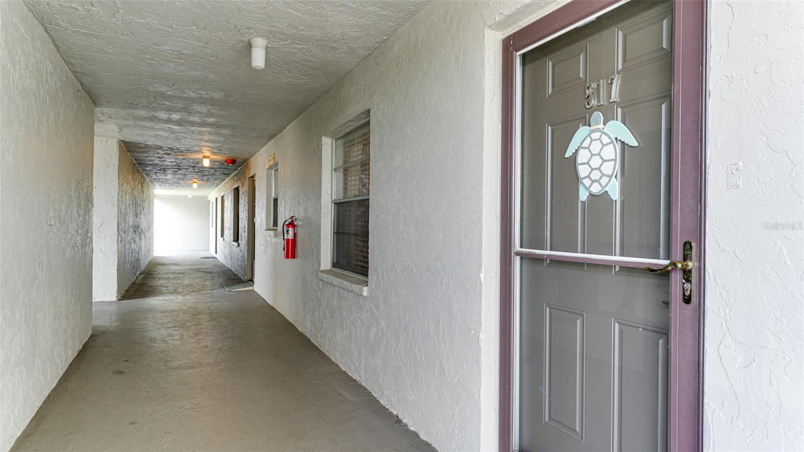 Welcome to this beautifully renovated two bedroom, two bath condo perched on the top (5th) floor, offering serene views of the greenbelt and pond. Tucked into the NW corner of building 'O' at Bayshore on the Lake, this one-of-a-kind unit sits conveniently near the elevator and is just a 7.5-mile drive from the beach. Step inside to find thoughtful upgrades throughout. In 2025, the home received a new HVAC system, water heater, refrigerator, electrical box, and lanai screens, while the washer and dryer were newly added in 2023. The renovated bathrooms showcase tasteful tile work and soft-close vanities, and the popcorn ceilings have been removed and resurfaced. Additional touches include 5" crown molding, a built-in entertainment wall with a modern electric fireplace, oversized tile in the kitchen and entry hall, and custom window treatments throughout the interior and lanai. Designed with a breezy coastal flair, the condo comes fully furnished — just bring your suitcase and head straight for the beach! Both the living room and primary bedroom open onto the screened back lanai, perfect for enjoying the cross breeze. Outside, the building boasts a newer roof and fresh exterior paint. Community amenities abound: take a short stroll to the Community Center for a dip in the lakeside pool just steps from the pier, unwind with a book in the spacious lounge area, or gather with friends at the picnic tables and grill. Kayak and canoe enthusiasts will love having designated storage space for a day out on the lake. Centrally located in Bradenton, you're close to shopping, dining, SRQ and Tampa airports, public transportation, and some of Florida's best beaches — with Bradenton Beach just a straight shot down Cortez Road. Enjoy low HOA fees and a warm, welcoming neighborhood in this top-floor gem. (Elevator access included!)