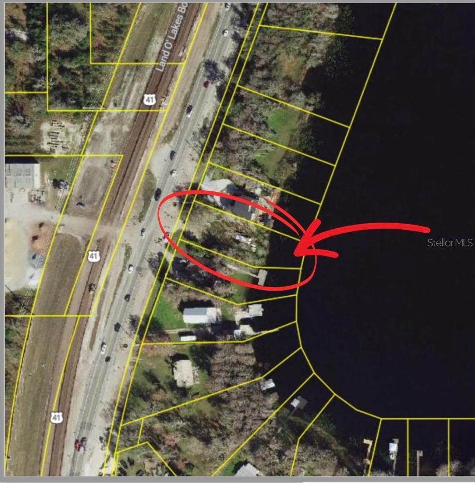 RARE LAKEFRONT OPPORTUNITY! This ½-acre vacant lot sits on a gorgeous boating and ski lake, just South of the 41 an 52 intersection, offering priceless lake views and direct water access for boating, skiing, jet skiing, and tubing. Bring all your toys—there are NO HOA and NO CDD! Nestled between two stunning homes, this is the perfect spot to build your dream lake house and enjoy the ultimate waterfront lifestyle.

Located near the sought-after Angeline and Mirada Lagoon communities, but without the restrictions, this area is booming with growth, making it a smart investment with skyrocketing value. This is a rare chance to own a slice of paradise with freedom and unlimited possibilities. Seller has the survey!
