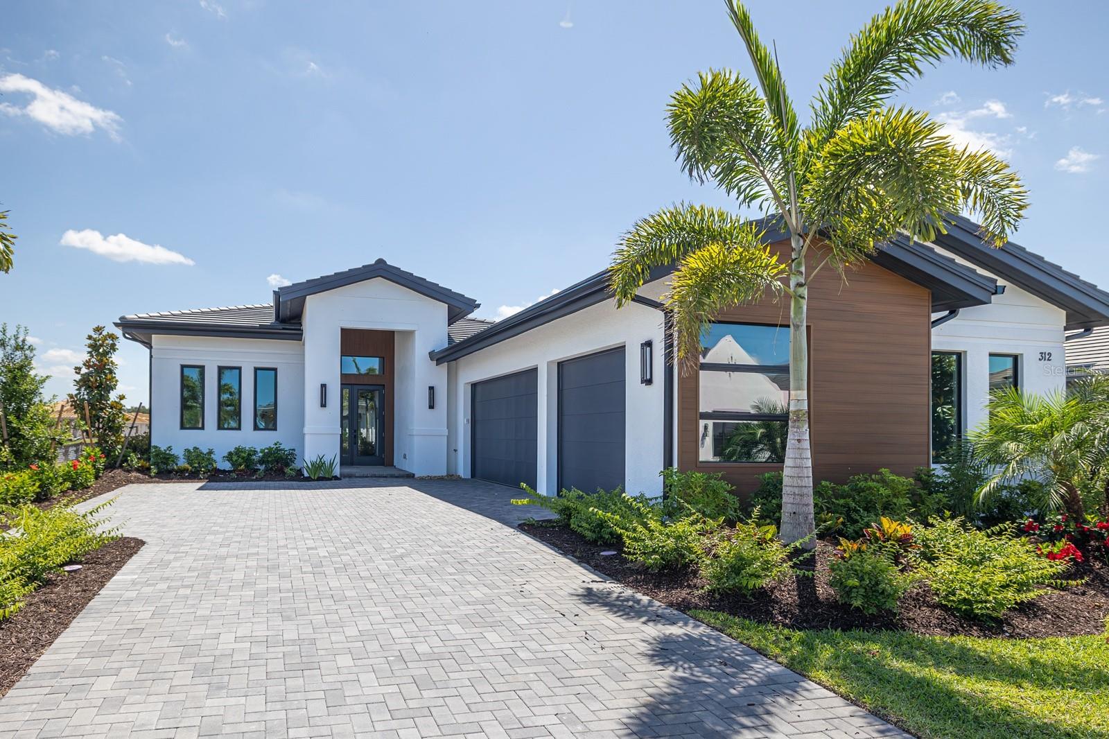 Newly priced as part of our QUICK MOVE IN INCENTIVE SPECIAL! 

Located in Wild Blue at Waterside, this Cambria IV by Stock Luxury Homes offers a balance of refined design and relaxed Florida living. Timeless architecture pairs with semi-custom finishes and an open, airy layout designed for both everyday comfort and effortless entertaining. The waterfront home features three bedrooms, three and a half baths, a spacious Great Room, an elegant Dining Room, and a private Study. Expansive sliding doors open to a generous outdoor retreat with pool and spa, creating a natural extension of the living space. A three-car garage adds everyday convenience. Showcasing our new modern elevation. 

Please contact us for additional inventory homes not yet listed in the MLS.