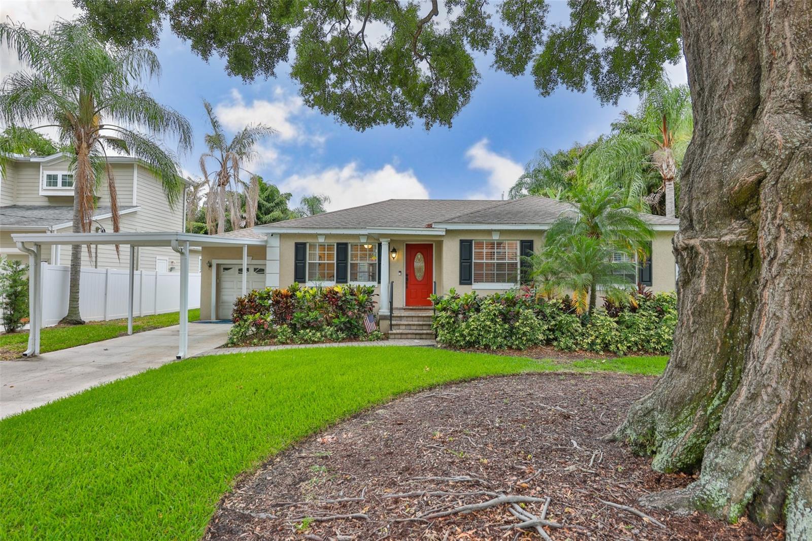 Welcome to an exceptional opportunity in one of South Tampa's most coveted neighborhoods?Palma Ceia. This charming 1952 residence offers 2,229 square feet of comfortable living space, featuring 3 bedrooms, 2 bathrooms, and timeless character blended with thoughtful updates.  Situated on a generous 75' x 120' lot, the fully fenced backyard is designed for entertaining, complete with an expansive two-level deck ideal for gatherings, outdoor dining, and relaxing. Inside, you'll find a combination of plank tile and hardwood flooring, updated bathrooms, and a well-appointed kitchen featuring newer appliances. French doors bring in abundant natural light and create a seamless connection to the outdoor living areas.  A versatile flex space provides endless possibilities as a home office, media room, playroom, or additional family room. Additional conveniences include a one-car garage and a covered carport and driveway for up to three vehicles.  Ideally located just minutes from Bayshore Boulevard, MacDill Air Force Base, premier shopping, fine dining, and everything South Tampa has to offer, this home delivers an exceptional walkable lifestyle. Enjoy a short stroll to Bayshore Boulevard as well as the popular restaurants, cafés, and boutiques along Bay to Bay Boulevard and MacDill Avenue. Located in FEMA Flood Zone X, no flood insurance is required.  This is a rare opportunity to enjoy the best of South Tampa living in one of the area's most desirable neighborhoods.