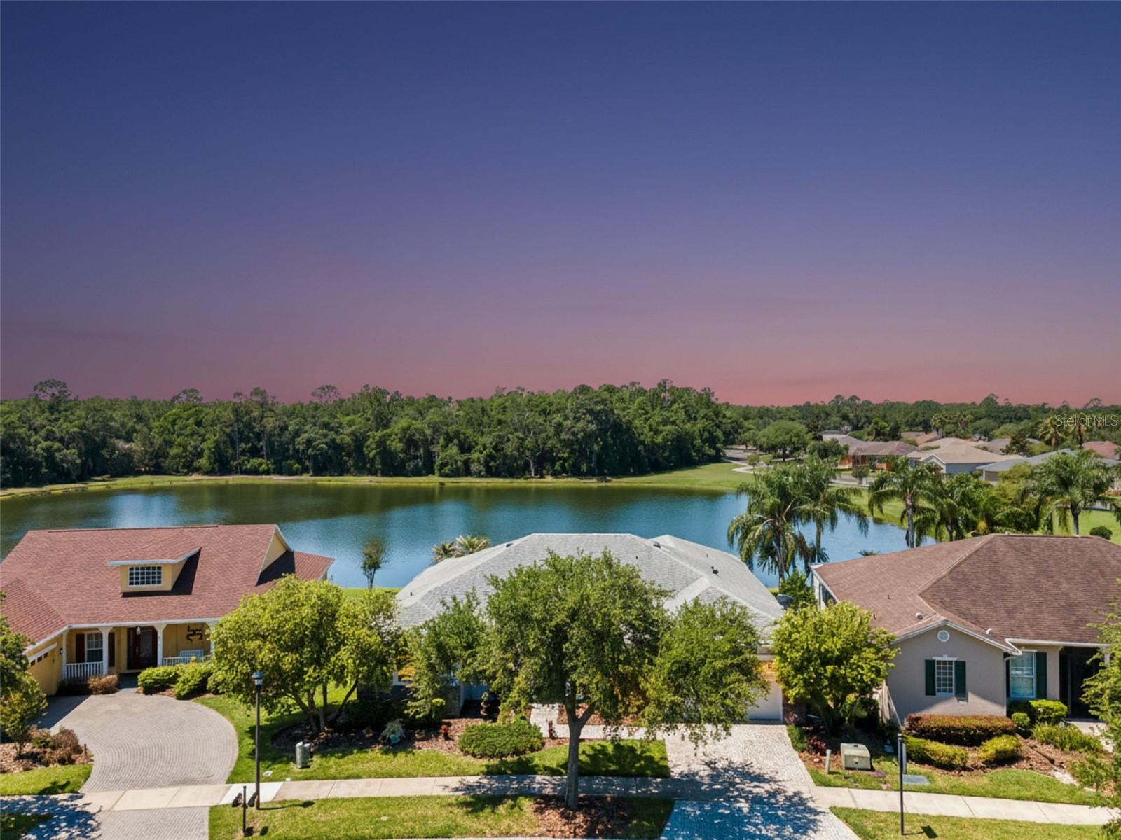 Welcome to this beautifully upgraded Operetta home offering breathtaking PANORAMIC WATER VIEWS with NO homes behind you… just peaceful water, mature trees, and stunning natural scenery! (Roof 2017), (AC 2024). **Furniture Negotiable!** Located just MINUTES from the VILLAGE CENTER, and on one of the community’s larger ponds! This rare setting boasts an EXPANSIVE LANAI (31' x 27') & provides the privacy and tranquility buyers dream about in Solivita. From the moment you enter, your eyes are immediately drawn through the 8-foot sliding glass doors to the expansive water views beyond. This home was designed to maximize natural beauty from nearly every rear window- including the primary suite, where you can wake up each morning to serene lake views right from your bed. Featuring 3 Bedrooms PLUS a private office with French doors, 2.5 baths, separate living and family rooms, and a split-bedroom floorplan, this home offers both comfort and ideal functionality for entertaining and guests. Elegant architectural upgrades include: 9’4” ceilings, Tray ceilings, Crown molding throughout, Rounded corners, 8-foot interior doors & sliders, 5¼” baseboards & so much more! The home is filled with warmth & style, featuring chic interior paint w/ beautiful accent walls, upgraded lighting and fans, ceramic tile throughout the main living areas, and laminate flooring in the bedrooms. The spacious kitchen is bright and inviting with skylights for abundant natural light, stainless steel appliances, 42” cabinetry with crown molding, glass cabinet inserts, and generous counter and storage space. The primary suite is a private retreat overlooking the water, complete with sliding glass doors to the lanai, two large walk-in closets, and a luxurious ensuite bath featuring dual sink vanities, a dedicated makeup vanity, soaking tub, and separate shower. Step outside to the true showpiece of the home- the fully covered and screened lanai, designed as an extension of your living space. Featuring beautiful stone-look tile flooring, ceiling fans, and ample room for dining, lounging, or creating an outdoor living room, this is the perfect place to enjoy Florida living year-round while taking in the breathtaking water and nature views. Additional highlights include a laundry room with cabinetry and storage, plus negotiable furnishings for buyers seeking a move-in ready or furnished opportunity. Solivita offers endless amenities including 14 heated swimming pools, indoor pool & indoor walking track, state of the art fitness centers, 17 pickleball courts, lighted tennis courts, two 18-hole Championship golf courses, over 250+ clubs to join, 3 community restaurants, Farmers Markets every Monday and Friday, and so much more! Poinciana Lakes Plaza is a MAJOR NEW SHOPPING CENTER that features so many restaurants and shopping. This is a rare opportunity! If you’ve been searching for privacy, panoramic water views, elegant upgrades, and one of the most peaceful settings in Solivita - this is the one!