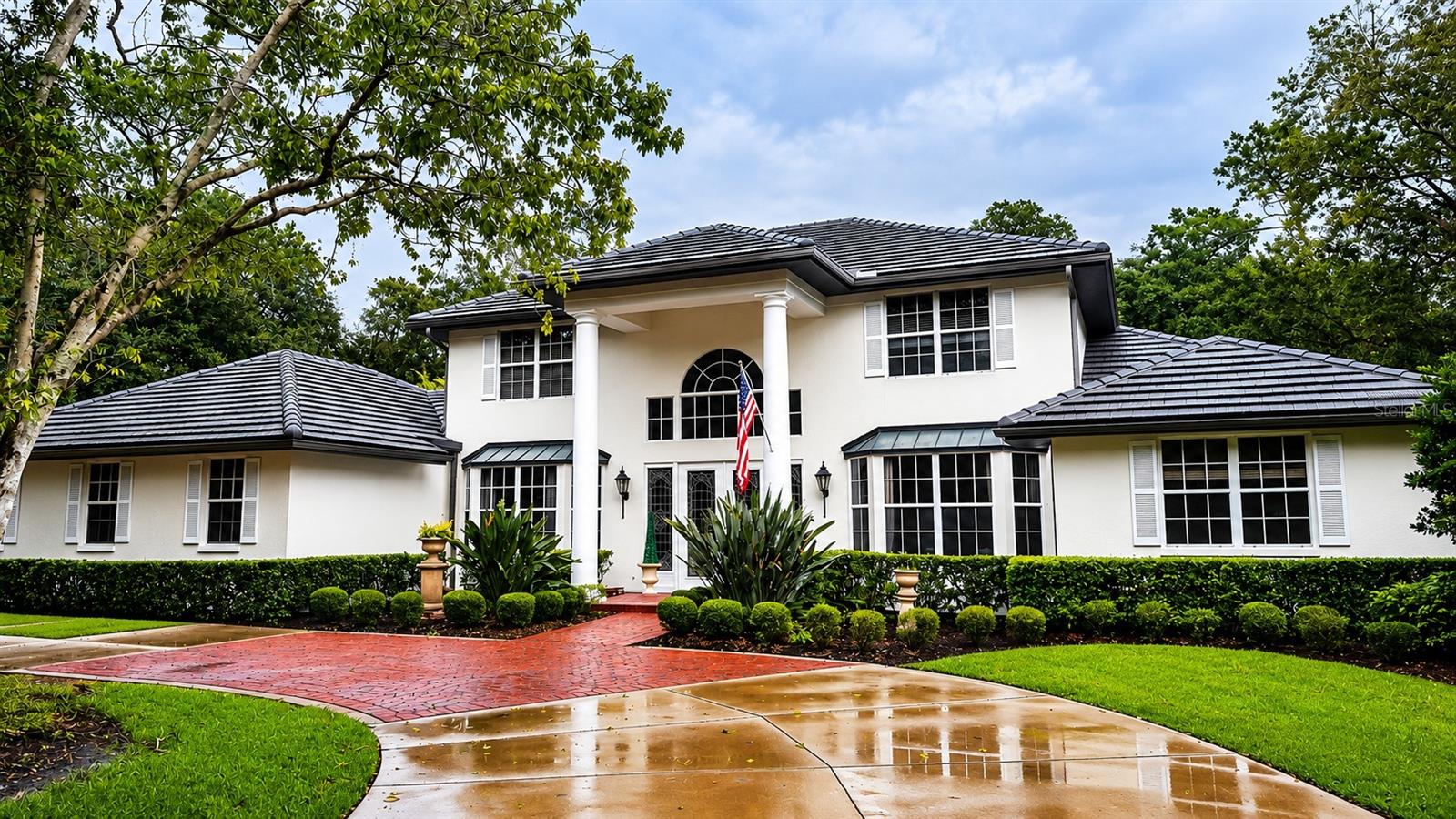 Welcome to one of the crown jewels of Laurel Oak Country Club, a stunningly renovated estate
situated on an exceptionally private homesite personally selected by the community's original
developer as his family residence. Golf membership is optional, but ownership of this
extraordinary home places you at the front of the membership waiting list.
Nestled on nearly one acre overlooking the Jones Course, this remarkable 5-bedroom residence
offers breathtaking views of the golf course, formal English gardens, and a custom creek with
waterfalls and pond. Thoughtfully updated with uncompromising attention to detail, the home
seamlessly blends timeless elegance with modern luxury.
Inside, you'll find real hickory wood flooring, two spacious primary suites, and a beautifully
renovated chef's kitchen featuring Sub-Zero, Miele, BlueStar, and Thermador appliances,
complemented by marble countertops and a large center island. The luxurious primary bath has
been completely remodeled with dual vanities, dual water closets, and an oversized walk-in
shower.
The grounds are truly spectacular. A formal English garden showcases antique brick pathways,
green walls, custom arbors, a fountain, and mature fruit trees including lemon, fig, and plum.
Sellers further enhanced the property with a picturesque creek, three waterfalls, and a tranquil
pond, all best enjoyed from the authentic clay paver patio. Additional fruit trees include lychee,
grapefruit, navel orange, banana, and mango.
This grand residence is loaded with upgrades and thoughtful features, including:
• New main A/C (2025) plus additional systems replaced in 2022 and 2023
• Roof replaced in 2019
• Impact-rated doors, windows, and sliders throughout most of the home
• Whole-house generator with 1,000-gallon underground fuel tank for hurricane preparedness
• Whole-house water filtration system with UV sanitizer
• UV Halo Ozonator integrated into the pool equipment
• New attic insulation
• New gutters, including custom copper gutters across the front elevation
• New epoxy garage flooring
• Heated and cooled craft/storage room in the garage

• Renovated Butler's Pantry
• Laundry room with pet shower and new plank flooring
• Outdoor kitchen with newer grill, sink, and granite countertops
• Brick flooring in the sunroom
• Fireplace rebuilt with Taj Mahal marble surround and custom paneled feature wall
• New designer chandeliers in the foyer and primary bath
• Upgraded fixtures, fans, and lighting throughout, including Perrin & Rowe and Restoration
Hardware selections
• Pool safety fence
• Extensive landscape lighting creating a magical nighttime setting
• Private second-floor balcony with custom sunshade
The home's unique positioning provides unmatched privacy, while winding walkways invite you
to explore this lush, park-like paradise.
This is more than a home—it's a private retreat, thoughtfully curated and meticulously
maintained, where no expense was spared. Experience the perfect combination of luxury,
comfort, beauty, and peace of mind in one of Laurel Oak's most exceptional properties.
King bed in primary suite does not convey.