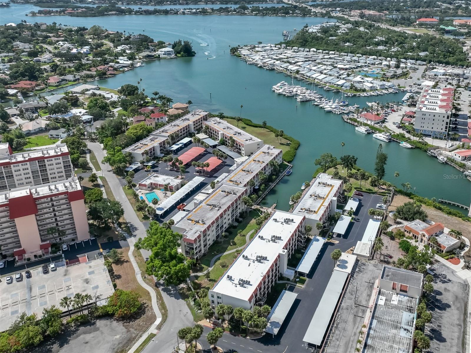 This charming 2-bedroom, 2-bath condominium comes Turn-key furnished and captures the essence of coastal living. Situated in the desirable Bella Costa community along the Venice Intracoastal Waterway, this island residence offers convenient access to downtown shops, restaurants, and local activities. With just over 1,000 square feet, the home features sleek laminate flooring throughout the main living areas and comfortable carpeting in both bedrooms.

The kitchen is beautifully updated with quartz countertops, stainless steel appliances, and upgraded cabinetry. The primary bedroom includes a walk-in closet and an en-suite bath, while the guest bedroom also offers a walk-in closet and its own private en-suite—ideal for hosting visitors. Additional conveniences include a designated carport space, a private storage closet, and elevator access within the building.

Bella Costa provides an impressive array of amenities, including a community pool, fitness center, clubhouse, and cozy fire pit area. With direct water access, residents can enjoy fishing, boating, or simply taking in the beauty of the Gulf.