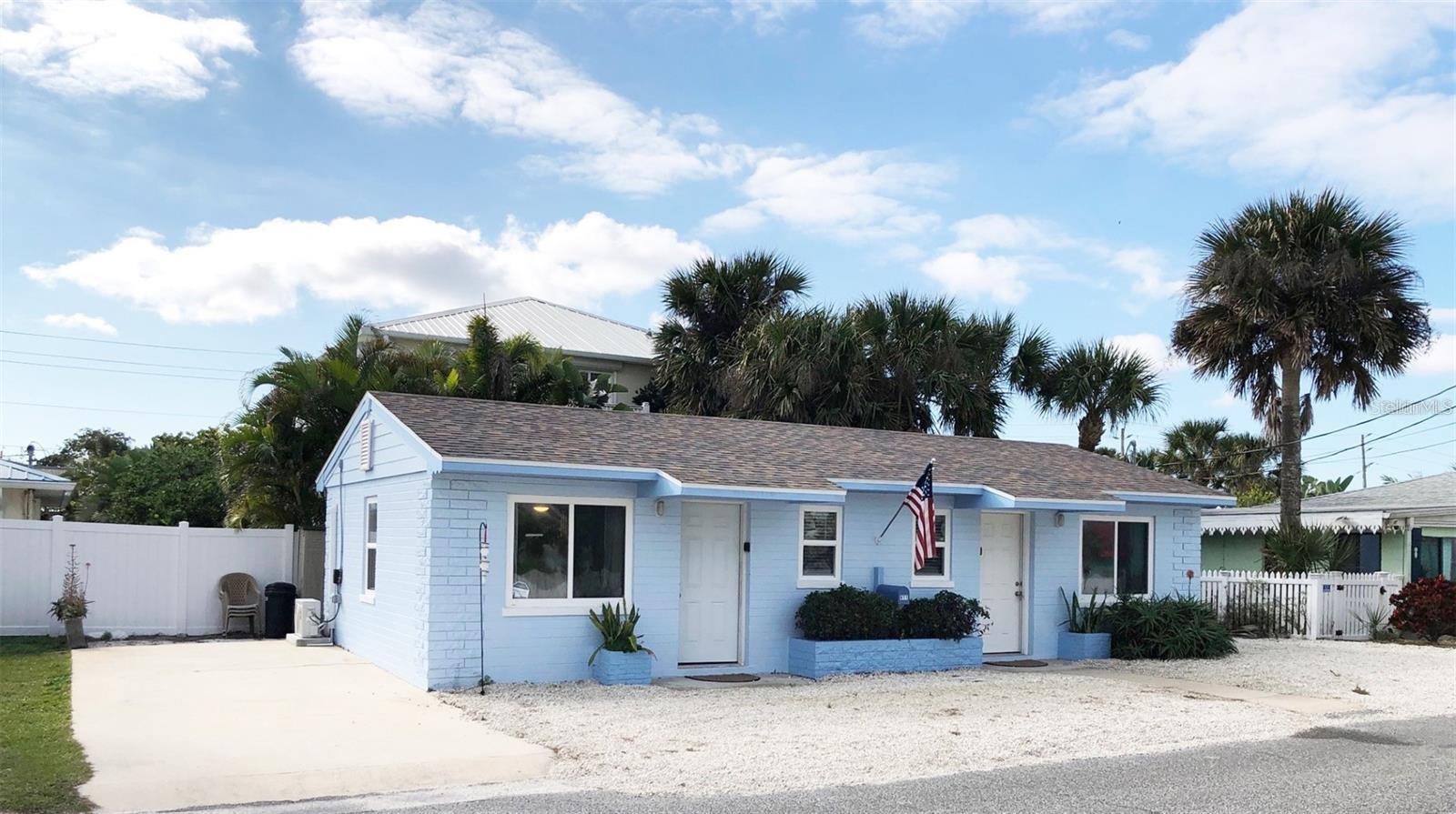 Charming & tastefully remodeled duplex located just a block from Flagler Avenue and a short stroll to the beach! Each side of this quaint coastal cottage offers an inviting atmosphere with ample natural light flooding through the windows. From the new wooden ceilings to the luxury vinyl floors, most everything was replaced in the last year including plumbing & light fixtures, kitchen appliances, mini split A/C systems, tankless water heater & more! Each side has 400 sq.ft. living area which includes a studio BR/LR area which is 13.10 x 18.5, a kitchen which is 10.11 x 4.5 and a bathroom which is 6.11 x 4.5. The well-appointed living spaces provide plenty of room to unwind after a day of exploring the vibrant art shows & festivals of New Smyrna Beach. Although set up as two units, there is only one electric meter, water meter & one hot water heater. Whether you're here for a short visit or planning a long-term stay, this duplex has everything you need to feel right at home. The fully equipped kitchen makes meal preparation a breeze, while the comfortable bedrooms offer a peaceful haven for restful nights. Each unit has a queen size bed plus a leather pullout sofa which are negotiable & can be conveniently included. Outside, you'll find a private rear patio with outdoor shower where you can enjoy your morning coffee or savor the warm Florida evenings with a refreshing drink. And with Flagler Avenue just steps away, you're never far from the best bars and restaurants in New Smyrna, ensuring endless opportunities for dining and entertainment. Don't miss your chance to experience the laid-back charm of New Smyrna Beach from this conveniently located duplex. Whether you're seeking a weekend getaway or a longer stay, this property promises an unforgettable stay in one of Florida's most beloved coastal towns. Available to rent for 30 days to enjoy and fall in love and start making memories in paradise!
