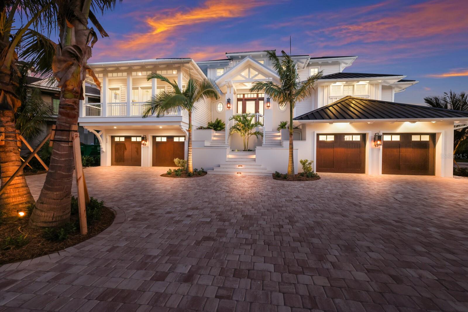 Brand New Construction ready to enjoy! ‘Casa Del Marae’ is majestically positioned along the pristine beaches of Boca Grande Pass. Its unique southern exposure will provide full sun and light in the winter months and beautiful sunsets over the Gulf of Mexico. Relish in the amazing panoramic water & lighthouse views, abundant sea life, and a front row seat to every Tarpon caught in Boca Grande Pass. The owners creative vision for this traditional coastal estate was brought to life by MHK Architecture and constructed by BCB Homes. With 5,700 + square feet of living space and over 12,000 total square feet this spacious estate has everything a selective Buyer would appreciate. The generous floor plan will offer 4-bedroom ensuites, an exercise room that could also serve as an additional bedroom, a top level viewing lounge, and a roomy media room with private balcony. Designed for the ultimate entertainment and family gatherings, this luxurious interior layout will present a must see double sided kitchen with fully equipped chef’s galley, prep area, and butler’s pantry. Wolf and Sub zero appliances will adorn this elegant kitchen together with custom high end wood cabinetry by Ruffino. Additionally, a built in wine chiller will be highlighted by a classic glass lit cocktail cabinet and wine rack. Master carpentry is presented in nearly every room with custom wood cladded ceilings and creative beam details complimented by white oak wood flooring and meticulously crafted trim & hardware. The exquisite VIP Suite will surely impress and provide elegance and solitude with exceptional water views and direct access to the spa & pool. Relax in the lush bath enclave with free standing Oceania tub and a showcase walk in shower offering double rain head controls. Custom double vanities with makeup counter, coffee cabinet, and built in closets will also be included. The massive 4 door garage and storage on lower level boasts over 4,700 square feet of vehicle parking and tons of extra space for all the toys. Outdoor living will be just as exceptional showcasing a summer kitchen with Alfresco grill, a fireplace with built in flatscreen tv, and a beautiful elevated heated pool & spa with decorative fire bowl water features. In addition, the guest wing will offer an open viewing terrace conveniently accessed by the lounge and suites. The exterior construction is next level and designed to protect against the harshest of elements. Remote control shutters and bug screens can be conveniently deployed to protect the outdoor living areas together with hurricane rated impact glass and doors installed throughout all openings. The generator ready home also features a full size elevator servicing all floors providing convenience and peace of mind through ownership. Location is exceptional with direct access to the private East beach, public beach, and a private fishing pier exclusive to this high end gated community.