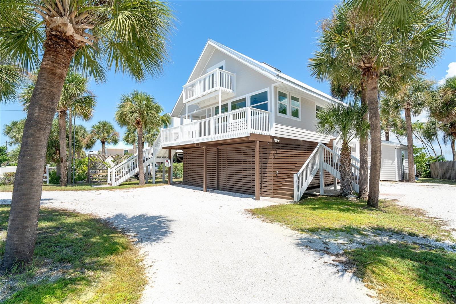 Totally renovated 3 bedroom 2 and 1/2 bath home with a spectacular water view and 3 minute access to the Intracoastal Waterway!!!  Dock will allow a good size vessel and there is a boat ramp for launching a kayak.  The updates include: new metal roof, flooring throughout, kitchen and bathrooms, air conditioning units, exterior paint, exterior decking and stairs, impact windows and doors, new appliances, fixtures and ceiling fans, ground level decks and storage areas......it is like a new home!  There are decks off the front and rear of the home, where you can enjoy glorious sunsets.  There are two primary bedrooms, one of each floor.  Floor plan allows many areas for privacy and would be an excellent rental should you decide to rent.  Located on Don Pedro-Knight-Palm island, a bridgeless barrier island situated between Ft. Myers/Naples to the south and Sarasota/Tampa to the north.  Pristine and uncrowded beaches are the highlight, however, there are many other things to capture your attention; shelling and searching for shark's teeth, boating, paddle boarding, kayaking, fishing, observing the abundant wildlife, swimming and "golf carting" around the island.  Buy your piece of paradise today to experience the peaceful island life!!!