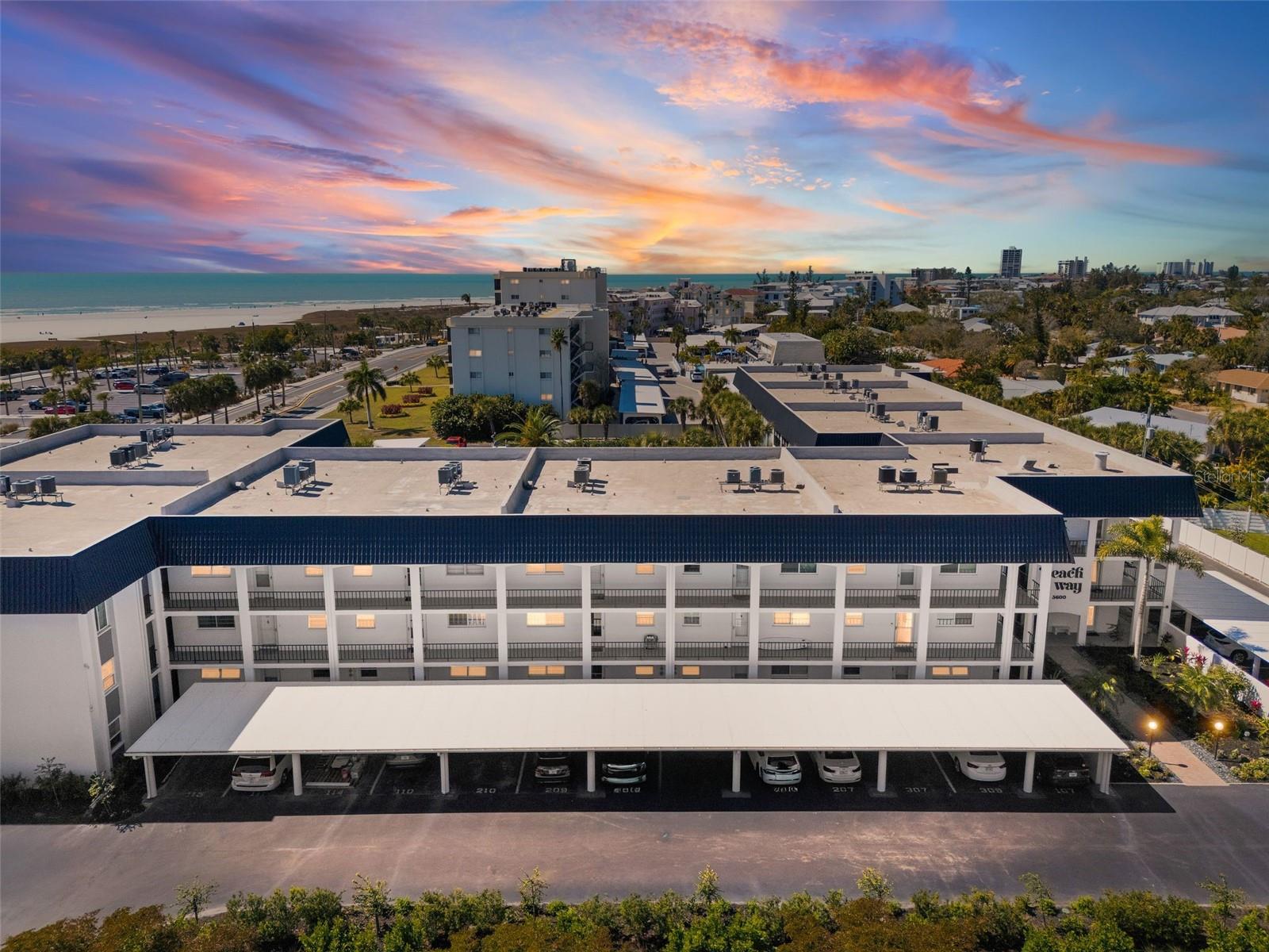 This newly listed condominium presents a distinguished opportunity to own a fully furnished residence directly across the street from the number one ranked beach in the world. Situated across the street from Siesta Key public beach, this property offers an exceptional blend of coastal elegance and investment potential.

The two-bedroom, two-bathroom split floor plan provides both privacy and functionality, complemented by easy-to-maintain tile flooring throughout. The screened lanai serves as the true centerpiece, offering breathtaking westerly sunset views over the beach and the heated community pool below, maintained at a comfortable eighty-five degrees for year-round enjoyment.

For those seeking rental income, this property is ideally positioned within an established monthly rental program. Its remarkable proximity to the beach, dining, and shopping in both the North and South Siesta Villages makes it a consistently sought-after destination for vacationers throughout the year.

The surrounding environment is nothing short of extraordinary. A short stroll leads to the pavilion and the warm, crystal-clear waters of the Gulf of Mexico. Nearby Phillippi Estate Park offers additional green space, while Morton's Siesta Market provides convenient grocery access just minutes away.

Community amenities further elevate the ownership experience, including a full kitchen in the community room for entertaining, saunas in the common areas, gas grills in the pool area, and one covered assigned parking space. This meticulously maintained complex reflects genuine pride of ownership at every turn.

Whether envisioned as a personal beach retreat or a productive investment property, this residence warrants your immediate attention. Schedule a private showing today.