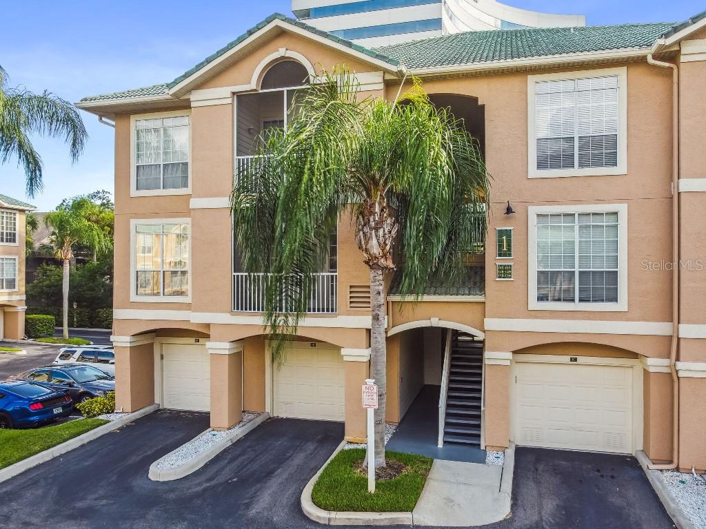 Luxury Corner Unit | Private Attached Garage | Waterfront Community

Discover one of the beautiful condominium addresses in the Tampa Bay area. This 1-bedroom, 1-bathroom corner unit offers an elevated lifestyle within a premier gated community situated on the shores of Tampa Bay.
The Residence:
    •    Main Living Area: Features durable porcelain tile flooring throughout, a kitchen with granite countertops, stainless steel appliances, and wood cabinetry.
    •    Functional Layout: A private, attached first-floor garage provides secure parking and storage. Entry to the second-floor living space is through a private interior staircase.
    •    Corner Unit Privacy: Enjoy the benefit of having only one shared wall and extra natural light.
Community Lifestyle: Residents enjoy exclusive access to luxury waterfront amenities. Relax at the heated saltwater pool, jacuzzi, or grilling area—all situated with a direct view of the Bay. The gated grounds also include a clubhouse, gym, sauna, and a community dock.
The Location:
    •    Beaches & Recreation: 3 mins to Ben T. Davis Beach; 25 mins to Clearwater. Direct access to the Courtney Campbell Trail for miles of scenic biking.
    •    Travel & Dining: Ideally located just 7 mins from Tampa International Airport. Bike to local favorites like The Rusty Pelican or Whiskey Joe’s.