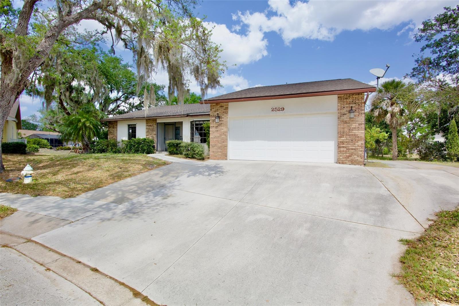 One or more photo(s) has been virtually staged. Welcome to this rare Colonial Oaks cul-de-sac gem, offering serene lake views and an ideal blend of comfort, style, and location. This beautifully updated 3-bedroom, 2-bath home with a dedicated office/den is nestled in one of Sarasota’s most sought-after communities.

Step through the formal entry into a spacious family room highlighted by a cozy wood-burning fireplace—perfect for relaxing or entertaining. New luxury vinyl plank flooring runs throughout the home, adding both elegance and durability. The fully updated kitchen features modern finishes and a separate eat-in space ideal for casual dining.

The primary suite serves as a private retreat, complete with a generous walk-in closet and a spa-like bathroom featuring a large soaking tub. Sliding glass doors open to a private patio where you can enjoy your morning coffee while overlooking the tranquil pond. Additional sliders from the living room and third bedroom lead to a screened-in lanai, creating seamless indoor-outdoor living.

With ample yard space, there’s plenty of room to personalize and make this home your own. Major upgrades include a new roof (July 2021) and a new AC system (2020), providing peace of mind for years to come.

Located just minutes from downtown Sarasota, you’ll enjoy easy access to vibrant shopping, dining, world-class beaches, parks, and endless amenities. This is a rare opportunity to own a lakeview home in an unbeatable location—don’t miss your chance to make this Sarasota dream home yours!