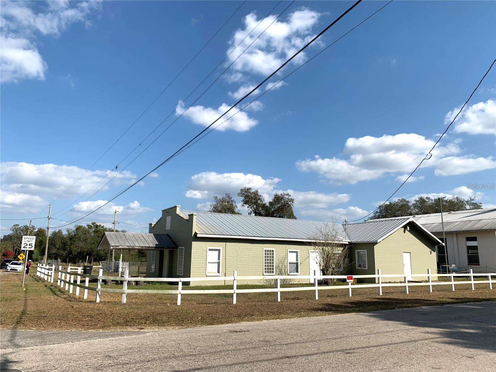 You can own this massive T-shaped brick house for the price of a mobile home.

Formerly a commercial property, it has been fully converted and upgraded for residential use. The property taxes, electricity, and trash fees are all currently classified as residential.

This is a large T-shaped brick home that can be divided into two completely separate spaces.

The rear part includes 3 bedrooms, 2 bathrooms, a living room, a kitchen, and a hallway sitting area—making it very comfortable for everyday living.

The front part features a huge open hall located on a corner lot at a busy intersection. It’s ideal for a gym, entertainment space, business use, wholesale operations, or other commercial purposes.

This property offers flexibility and opportunity. You can live in one part and rent out the other to help pay the mortgage, or use it to support and grow your business. Because it can function as two independent spaces, it has strong investment potential.

The home includes newly installed window A/C units, an energy-efficient water heater, freshly painted walls, and an upgraded electrical panel. The water pump is NOT working, which need the buyer to repair after closing.

This T-shaped brick building was constructed through the dedicated efforts of previous owners and effected in 1993. The interior partition walls in the rear part are solid brick, making the structure especially strong and durable.

This is a hidden gem—an unpolished diamond with incredible potential. With the right vision, it can truly shine.

Sold as-is. Buyers are encouraged to conduct their own inspections. Agents are welcome to bring qualified buyers for showings. If there is a need for commercial use, the buyer may apply to have the property rezoned back to commercial after purchase.