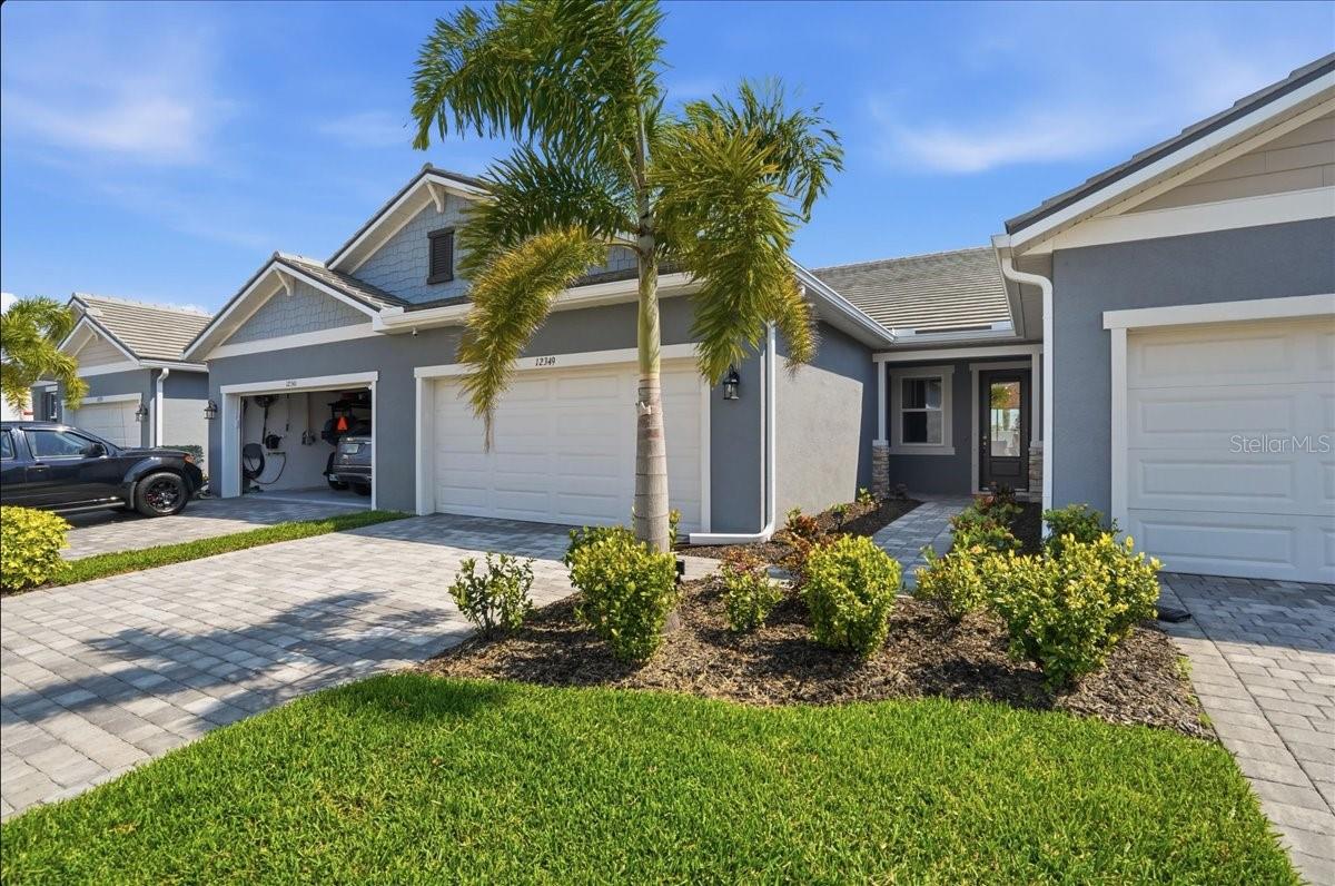 Welcome to your dream home in the newly established, gated community of Sunstone, located within one of the top-ranked master-planned communities—Wellen Park! This beautifully upgraded 3-bedroom, 2-bathroom villa with a versatile room offers the perfect blend of style, comfort, and peace of mind.

This home showcases an abundance of upgrades throughout, including tile flooring in every room, recessed lighting on dimmers, and ceiling fans in all living spaces and bedrooms for added comfort. The thoughtfully designed kitchen features stainless steel appliances, additional designer pendant lighting over the island, a stylish upgraded tile backsplash, and pull-out cabinet shelving, perfect for both everyday living and entertaining.

The garage features professionally epoxied flooring, creating a sleek, durable, and easy-to-maintain space for storage or hobbies. The main living areas showcase elegant crown molding, which extends into the spacious primary suite with a tray ceiling that even features its own crown molding!

The primary bathroom features an upgraded walk-in shower with a built-in bench, creating a spa-like retreat. Step outside to your south-facing patio, complete with screened-in lanai, perfect for enjoying Florida living year-round.

Sunstone residents enjoy a maintenance-free lifestyle and an array of resort-style amenities, including a pool, pickleball courts, fitness center, clubhouse, dog park, and open green spaces. A full-time lifestyle director coordinates community events, making it easy to stay active and connected. Conveniently located near the center of the community, this home is just a short walk to all amenities.

Ideally situated in the heart of Wellen Park, you are less than two miles from Downtown Wellen Park, featuring new shops, restaurants, live music, a weekly farmers market, and monthly signature events. For beach lovers, you’re just a 20-minute drive from three of Florida’s pristine Gulf Coast beaches.

Wellen Park is home to A-rated schools, including Prodigy Early Learning, Primrose School, and the College Preparatory Academy at Wellen Park. The new Wellen Park High School is scheduled to open for the 2026–2027 school year, with plans for an additional K–8 school in the future.

Enjoy peace of mind with convenient access to top healthcare providers such as Sarasota Memorial Hospital, HCA Florida Wellen Park, and Millennium Physician Group. Located in Flood Zone X, this property does not require flood insurance.

Don’t miss your opportunity to own this move-in-ready home in one of Southwest Florida’s most desirable communities, schedule your private showing today!