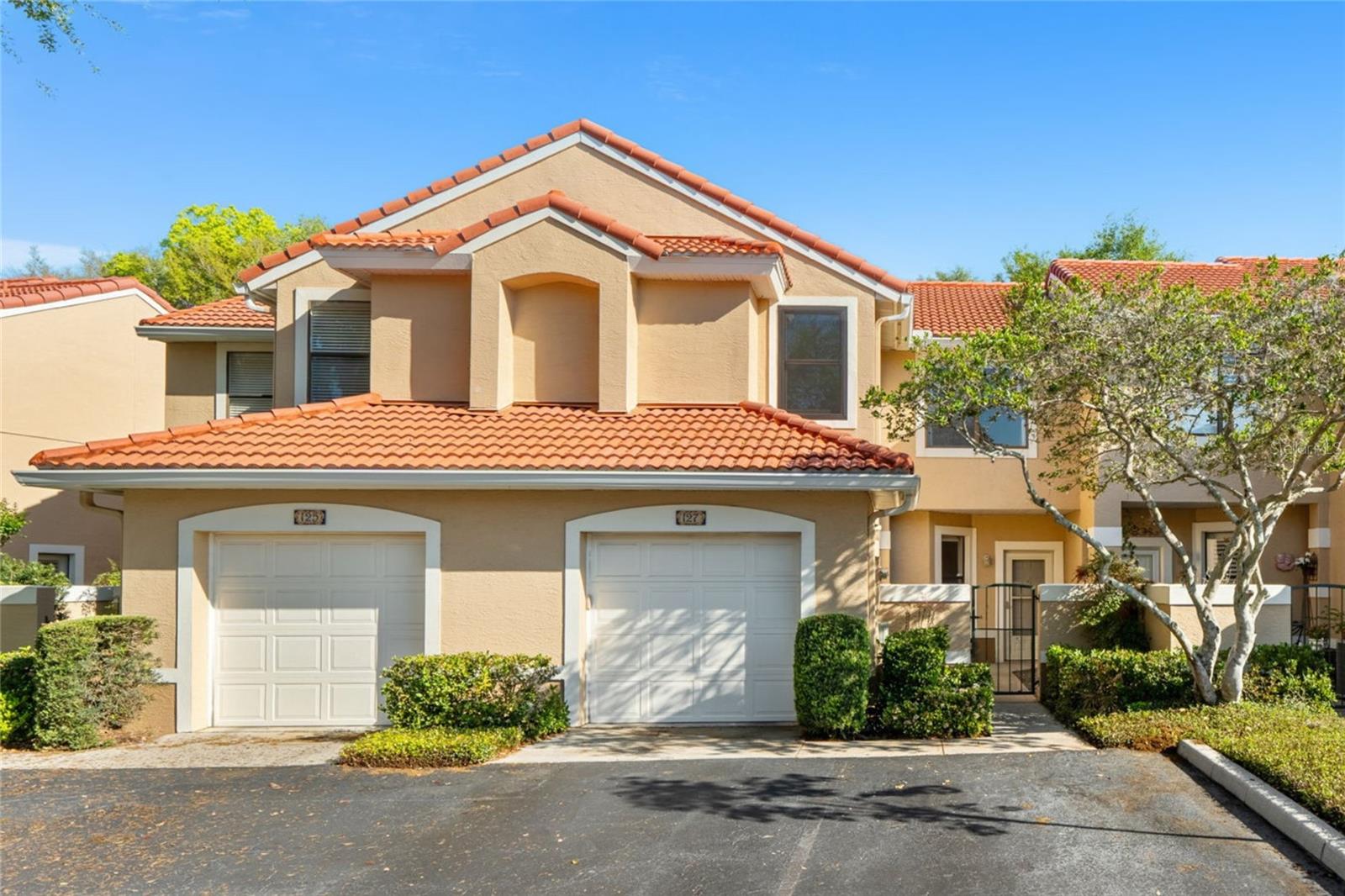 Back on the market through no fault of the property. Recently appraised at $340,000 and inspections were completed without issue. A great opportunity for a qualified buyer seeking a smooth transaction and quick closing. Tucked into one of Maitland's most coveted lakefront enclaves, this beautifully updated townhome sits within a quietly maintained, tree-lined setting with direct access to Lake Destiny, a private community boat ramp, resort-style pool, and tennis courts, all just minutes from I-4, the 414, RDV Sportsplex, and the dining and shopping corridors of Maitland Center. First impressions set a private and secluded tone with a wrought-iron gated courtyard leads to a covered entry porch before you reach the front door. Inside, soaring vaulted ceilings and a dramatic arched transom window above the sliding glass doors flood the main level with natural light, creating an airy, open feel that far exceeds the square footage on paper. Wide-plank tile flooring runs throughout the main living areas, connecting the open living and dining spaces to a thoughtfully updated kitchen featuring white shaker cabinetry with crown accents, solid stone countertops, stainless steel appliances including a French door refrigerator and built-in microwave, pendant lighting above the breakfast bar peninsula, and a subway tile backsplash. The sliding doors open directly to a private screened patio framed by mature landscaping, creating the kind of indoor-outdoor flow that defines Florida living at its best. Upstairs, three generously sized bedrooms each offer ceiling fans, ample closet space, and brand new carpet and paint. The primary suite stands out with a 26ft footprint, two closets including a walk-in, and an ensuite bath featuring dual vanities, a full-wall vanity mirror, and a walk-in shower. Two additional bedrooms and a full bath complete the upper level, with the layout providing genuine separation and privacy between spaces. Back on the main floor, a versatile 9x9 bonus room with indoor laundry handles the day-to-day,
and the full-size washer and dryer convey. The big-ticket items are handled: 30-year tile roof replaced in 2023, HVAC installed in 2020, and brushed nickel fixtures updated throughout. The one-car garage with additional driveway parking and the gated courtyard entry give this unit a sense of privacy and security rare in townhome living. Whether you are looking for a low-maintenance primary residence, a lock-and-leave second home, or a smart investment in a well-managed community with real amenities and a lakefront address, this one makes an easy case.