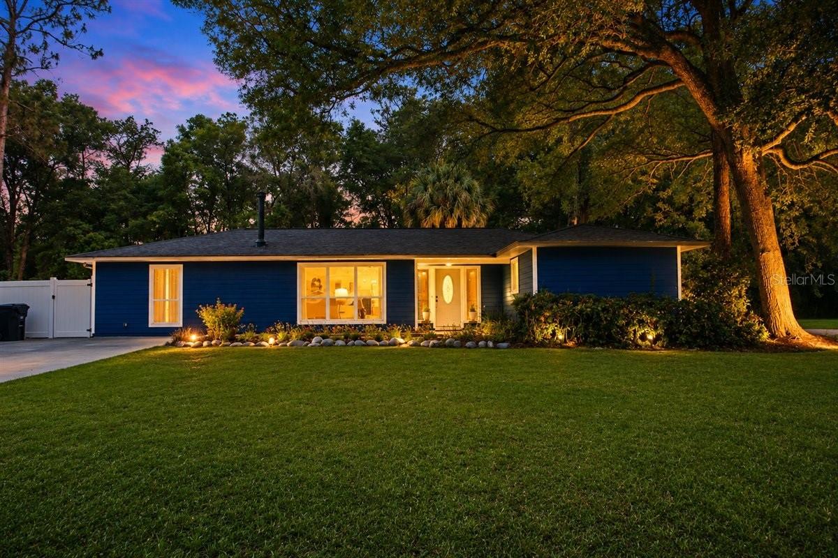 One or more photo(s) has been virtually staged. Beautifully updated 4BR/2BA concrete block home situated on a private 1.02-acre lot in unincorporated Gainesville just off Archer Road. Surrounded by mature trees and offering the perfect blend of space, privacy, and convenience, this property is only minutes from I-75, shopping, restaurants, hospitals, and schools.

Inside, you’ll find a spacious and inviting layout featuring a large living room, separate dining room, luxury vinyl plank flooring, abundant natural light, and fresh interior paint throughout. The efficient wood-burning pot belly stove creates a warm focal point while helping keep utility costs down. Recent improvements include upgraded windows and sliding glass door, new AC ductwork, newer dishwasher and refrigerator, exterior siding updates, fresh exterior paint, and a new septic drain field.

The outdoor living space is where this property truly shines. Enjoy the oversized screened back porch overlooking a massive paver patio and expansive fenced backyard — perfect for entertaining, relaxing, gardening, pets, or simply enjoying the peaceful setting. Additional features include a 12x12 storage shed, carport, & large chicken coop, and plenty of room for boats, trailers, hobbies, or future outdoor projects.

Served by Clay Electric for more affordable utility bills. If you’ve been searching for move-in ready country living with modern updates and room to spread out, this North Central Florida property is a must see.