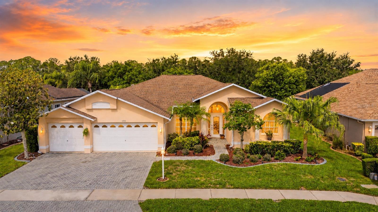 Perfectly positioned on highly sought-after Trimaran Place with breathtaking golf course views, this exceptional estate home offers the ideal blend of luxury, comfort, and effortless Florida living. ROOF REPLACED 2018; FRESHLY PAINTED INTERIOR; NEW INTERIOR/EXTERIOR LED RECESSED LIGHTING; UPGRADED TO A NEW & LARGER POOL SALT CELL - SEE COMPLETE LIST AT END OF THESE REMARKS. Designed for both elegant entertaining and everyday enjoyment, the spacious open-concept floor plan features soaring ceilings, graceful architectural details, arched doorways, and a timeless neutral color palette throughout. A welcoming entry leads to the formal dining room and expansive living area, where stunning views of the lanai, pool, and fairways create a beautiful backdrop. At the heart of the home, the chef's kitchen is sure to impress with stone countertops, stainless steel appliances, recessed lighting, a large breakfast bar, upgraded reverse osmosis water system under the sink, and a sunny breakfast nook. The kitchen flows seamlessly into the family room and outdoor living spaces, making gatherings with family and friends effortless. The private primary suite serves as a relaxing retreat, complete with soaring ceilings, direct lanai access, and a spa-inspired bath featuring a stone vanity, soaking tub, and spacious walk-in shower. Generously sized guest bedrooms offer abundant closet space, while the oversized laundry room provides excellent storage and convenience. Step outside and discover your own resort-style oasis. The screened lanai features a sparkling pool, relaxing spa, and expansive covered seating areas—perfect for enjoying your morning coffee, hosting guests, or unwinding while taking in the peaceful golf course views. Completing this remarkable home is a highly desirable three-car garage with WiFi enabled cameras and controls to the garage doors - all of this in an unbeatable location. Offering exceptional indoor-outdoor living and spectacular surroundings, this is more than a home—it's the Florida lifestyle you've been dreaming of. 55 & FUN - LIVE THE HERITAGE SPRINGS LIFESTYLE - Resort style living at its absolute finest! Clubhouse with restaurant and bar, fitness, tennis, golf, cards, billiards, dancing and more! SUPERB TRINITY LOCATION, CLOSE TO BEACHES, DINING, SHOPPING, MEDICAL AND AIRPORT! Caution - Adults at Play! FULL LIST OF UPGRADES & IMPROVEMENTS: FRESHLY PAINTED INTERIOR; INSTALLED TWO (2) OVERHEAD STEEL GARAGE STORAGE RACKS; INSTALLED/REPLACED ALL RECESSED LIGHTING W/NEW LED LIGHTING (INTERIOR/EXTERIOR); INSTALLED/REPLACED TWO (2) EXTERIOR CEILING FANS W/LARGE ATOMI WIFI ENABLED LED FANS (INCLUDES CHANGING COLOR LIGHTS) W/REMOTES; INSTALLED/REPLACED FAMILY ROOM CEILING FAN W/ATOMI WIFI ENABLED LED FAN W/REMOTE; REPLACED POOL SALT CELL W/NEW/LARGER CELL (IMPROVED PERFORMANCE AND LONGEVITY); REPLACED/REPAIRED POOL LIGHT W/NEW LED POOL LIGHT; REPAIRED POOL VACUUM MOTOR; INSTALLED WIFI ENABLED NEST THERMOSTAT; INSTALLED WIFI ENABLED GOOGLE CAMERA/DOORBELL; INSTALLED WIFI ENABLED NEST YALE FRONT DOOR LOCK (REPLACED HANDLE/HARDWARE); INSTALLED GUTTER EXTENDERS/GUTTER SPLASH GUARDS; REPLACED SPRINKLER MASTER CONTROLLER (TO BE DONE).