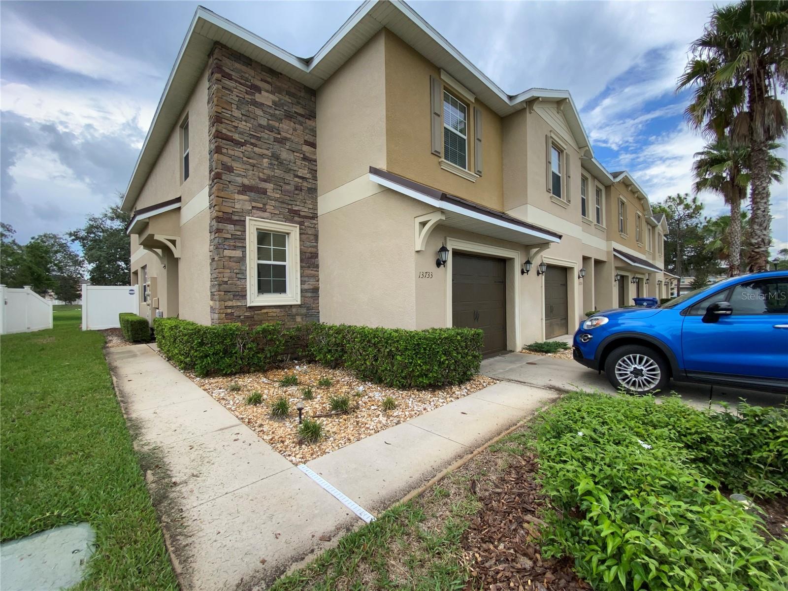 Welcome home to this beautifully maintained 3-bedroom, 2.5-bath corner-unit townhome with a 1-car garage, located in the highly sought-after Verandah Townhome community. Step inside to find a convenient half bath for guests and a spacious open-concept layout designed for comfortable everyday living. The kitchen features granite countertops, a full appliance package, a large pantry, and bar seating for casual dining, plus a convenient desk area just off the kitchen. A dedicated dining space and generously sized living room provide plenty of room to relax and entertain.

Upstairs, you’ll find all three bedrooms, including a spacious primary suite with a walk-in closet and private ensuite bath featuring dual vanities and a large walk-in shower. The two secondary bedrooms share a full bath with a tub/shower combination.

Step outside through the rear door to enjoy the oversized fenced paver patio—perfect for relaxing or entertaining—with serene natural views and added privacy. Ideally located near shopping, dining, entertainment, and medical facilities, this home offers both comfort and convenience. Don’t miss your opportunity to make it yours—schedule your showing today!